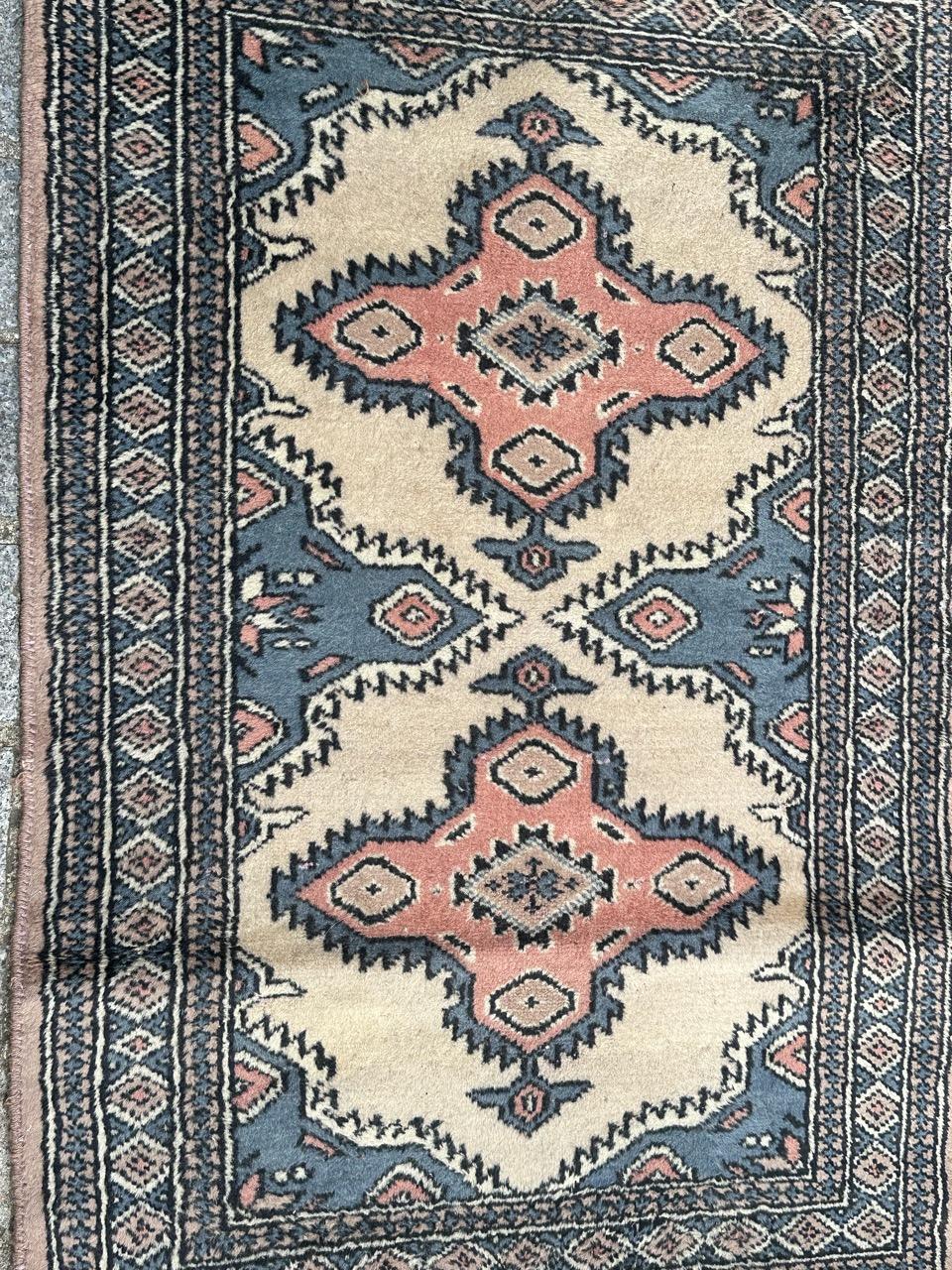 Pretty small vintage Pakistani rug with nice geometrical design in style of Turkmen rugs, and beautiful colours with beige field, pink, blue , white and black, entirely and finely hand knotted with wool on cotton foundation.

✨✨✨
