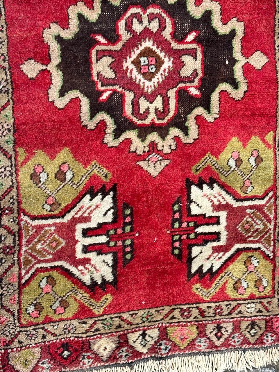Oushak Bobyrug’s pretty small vintage Turkish Yastik rug For Sale
