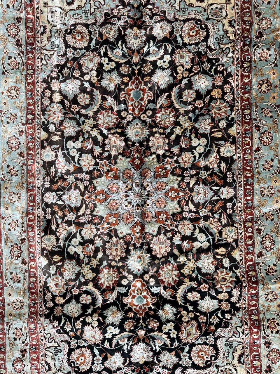 Introducing a stunning vintage Persian Tabriz-style rug, meticulously hand-knotted in China on a silk foundation. This masterpiece features a captivating royal garden scene, with majestic stylized flowers and a pretty médaillon in hues of orange ,