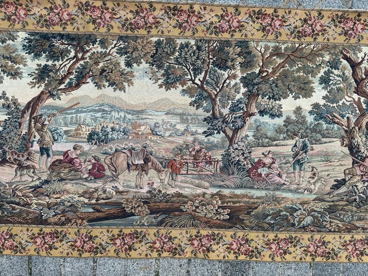 Pretty vintage French Aubusson style tapestry woven on mechanical jacquard looms with wool and cotton with a design of « Hunters' stop »

Based on an Aubusson tapestry, mid-18th century. The Aubusson weavers who traditionally created “greenery” or