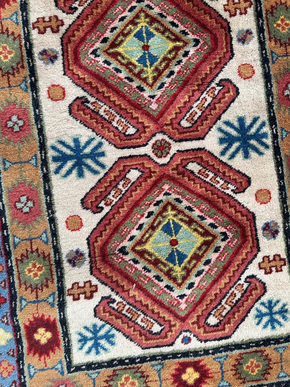 20th Century Bobyrug’s pretty vintage little Caucasian design Sinkiang rug For Sale