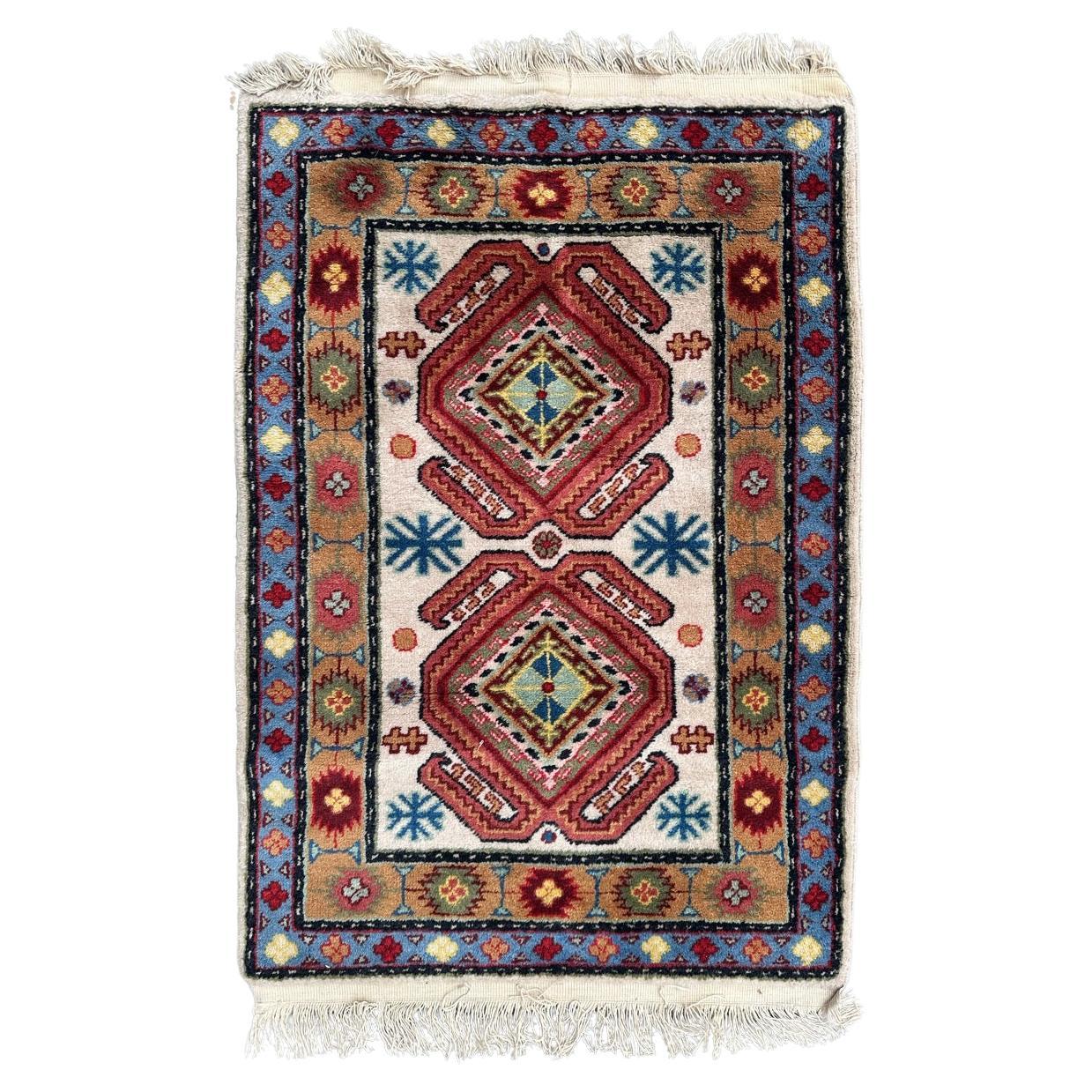 Bobyrug’s pretty vintage little Caucasian design Sinkiang rug For Sale