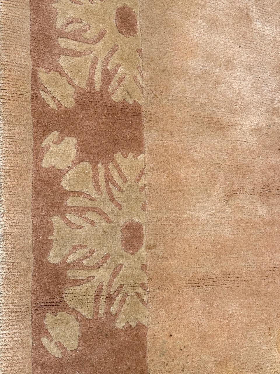 Pretty vintage modern design Nepalese rug with a simple design with a cream open field with design and a light border with stylized flowers on a light brown, around the field. Entirely hand knotted with wool on cotton foundation.

✨✨✨
