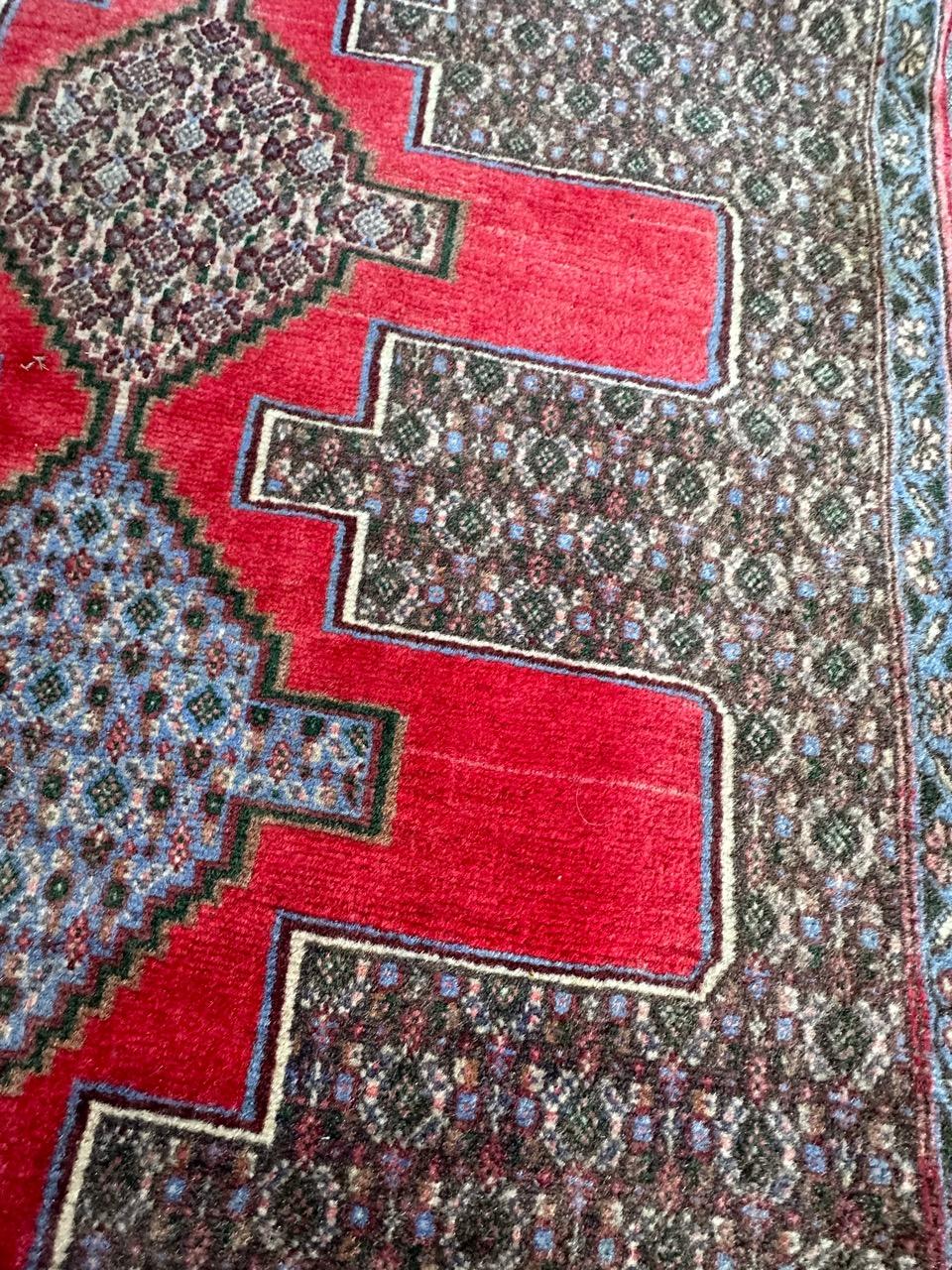Tabriz Bobyrug’s pretty vintage Senneh rug For Sale