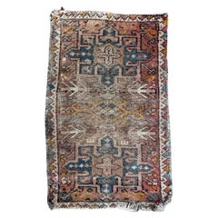 Vintage Bobyrug’s small mid century faded distressed Heriz rug 