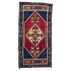 Vintage Bobyrug’s small mid century Turkish Yastik rug 