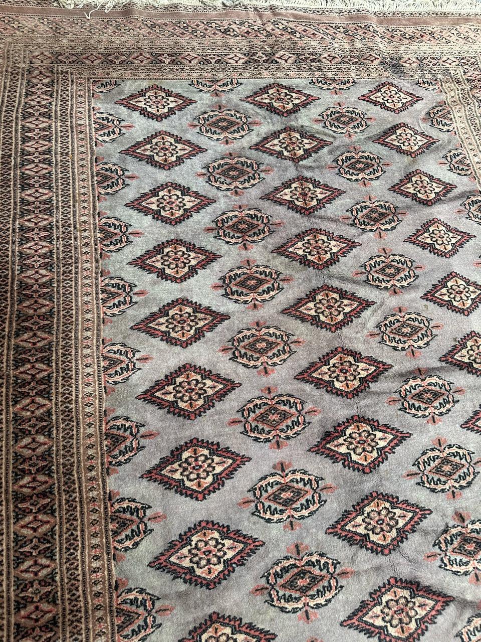 Vintage Pakistani rug with a tribal style Turkmen design and with a sky blue on field, pink, black and white on design, some wears due to the age and the use, entirely hand knotted with wool on cotton foundation 

✨✨✨
