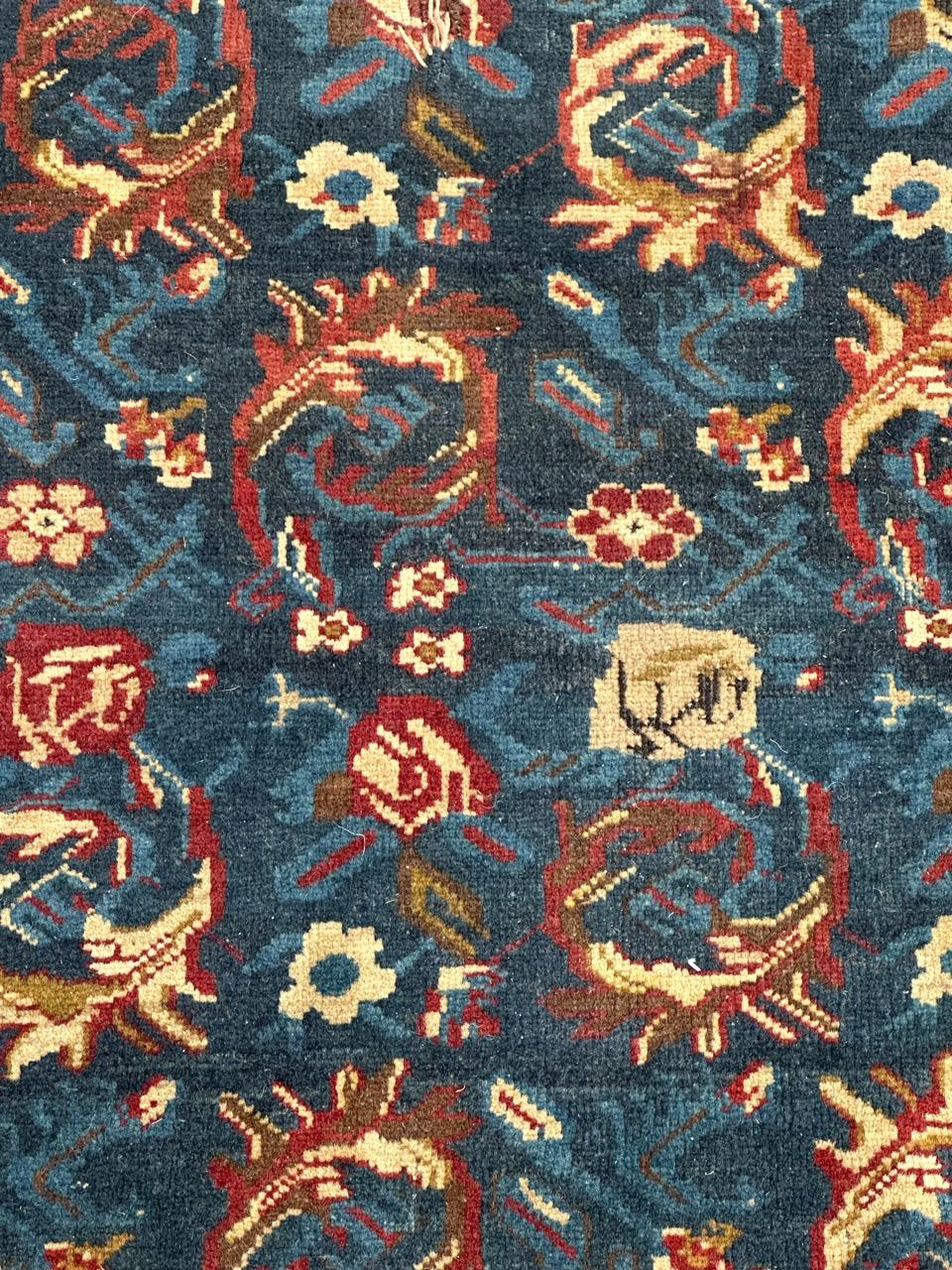 Very beautiful late 19th century Armenian Karabagh rug with beautiful and rare stylized floral design and nice natural colours with a blue navy field, red, white and gold, entirely and finely hand knotted with wool pile on wool foundation. 
Some
