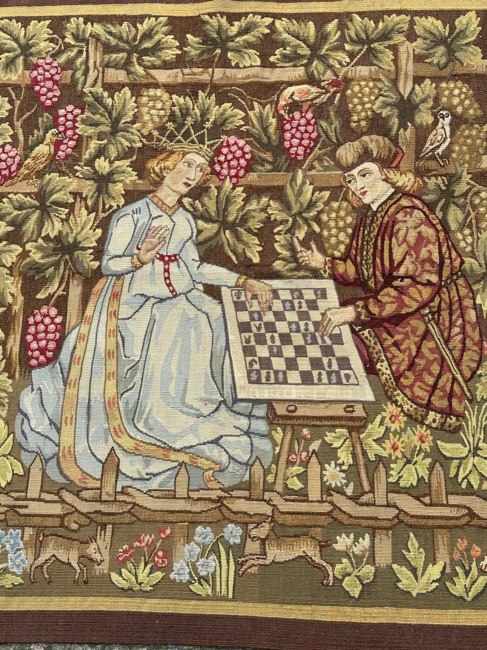 Very beautiful and Aubusson tapestry with a nice design featuring a medieval design with the king and queen playing chess, with beautiful colours, with yellow, green , brown, blue and, pink and red, entirely and finely handwoven with wool at