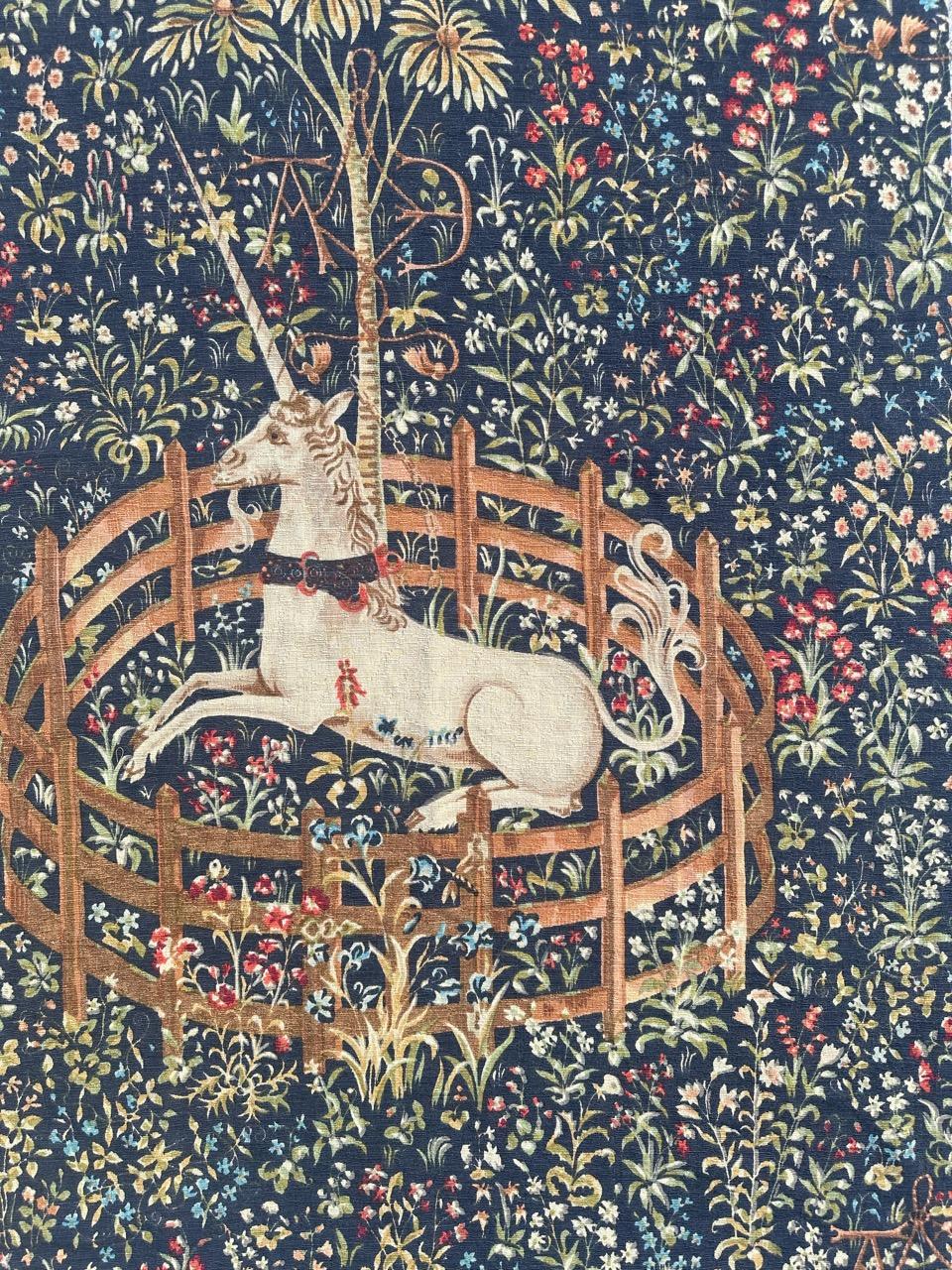 Pretty mid century French hand printed tapestry from Robert Four manufactury in Aubusson with the design of a museum tapestry « unicorn in captivity » in a 
Mille fleurs (thousand flowers) background.

Replica of ancient tapestry printed to the