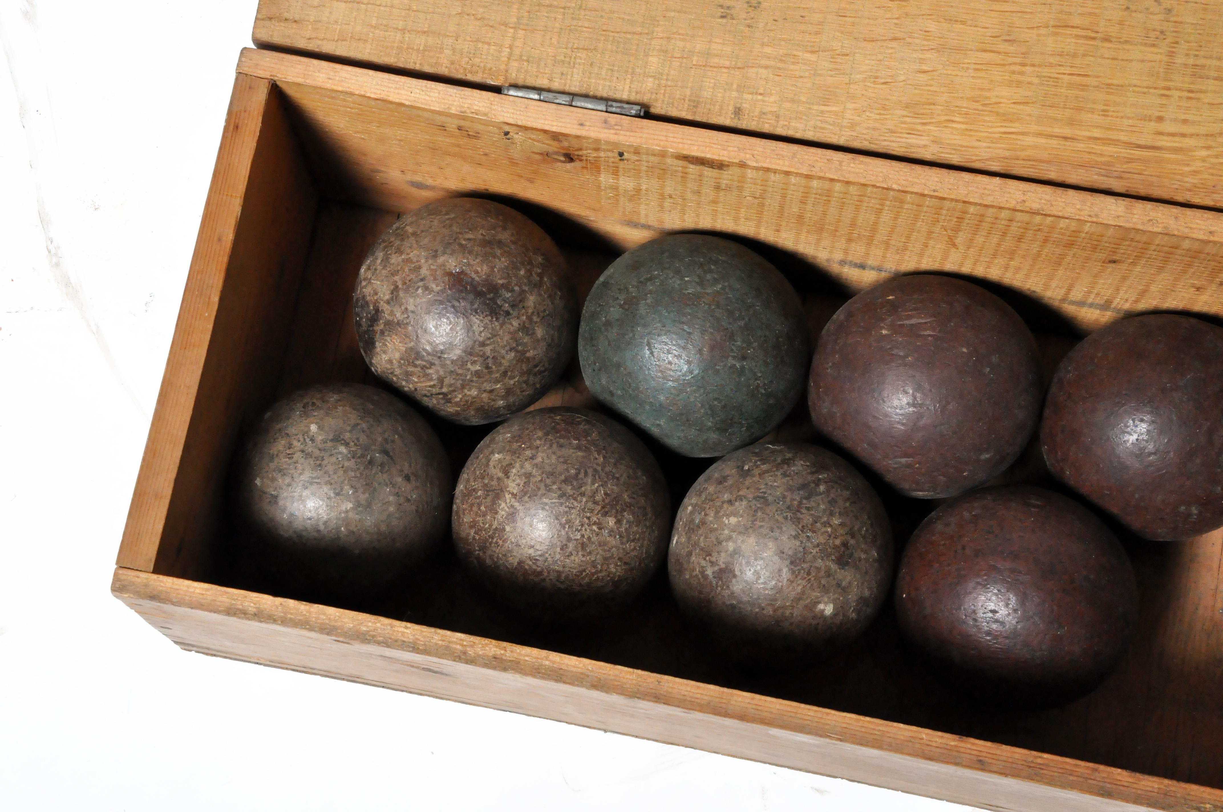 This set of 13 bocce balls a wooden box was acquired in France and most likely dates to the late 20th century. Box is included. Wear consistent with age and use.
 
