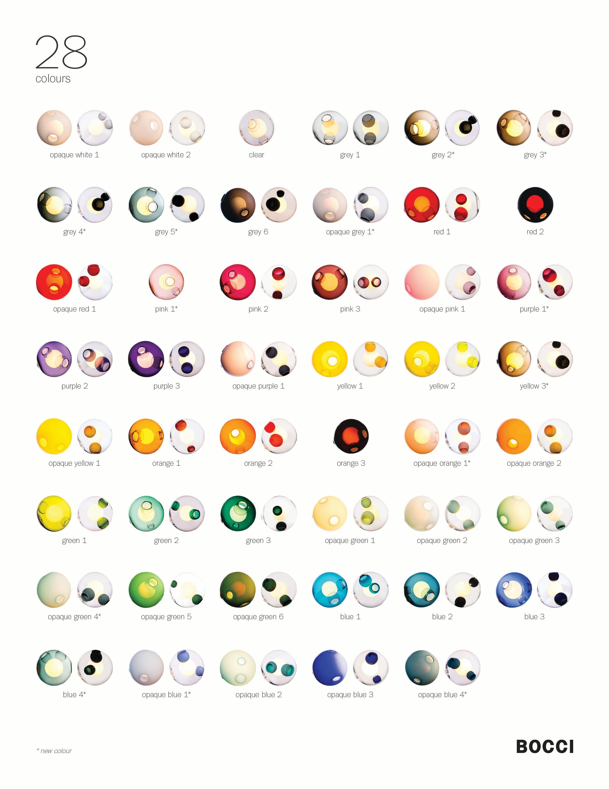 The 28.19 cluster color is a chandelier composed of 19 mouth blown spheres in color. There are a possible 64 colors to choose from and the spheres can be transparent color, opaque color or you can chose only to have the 
