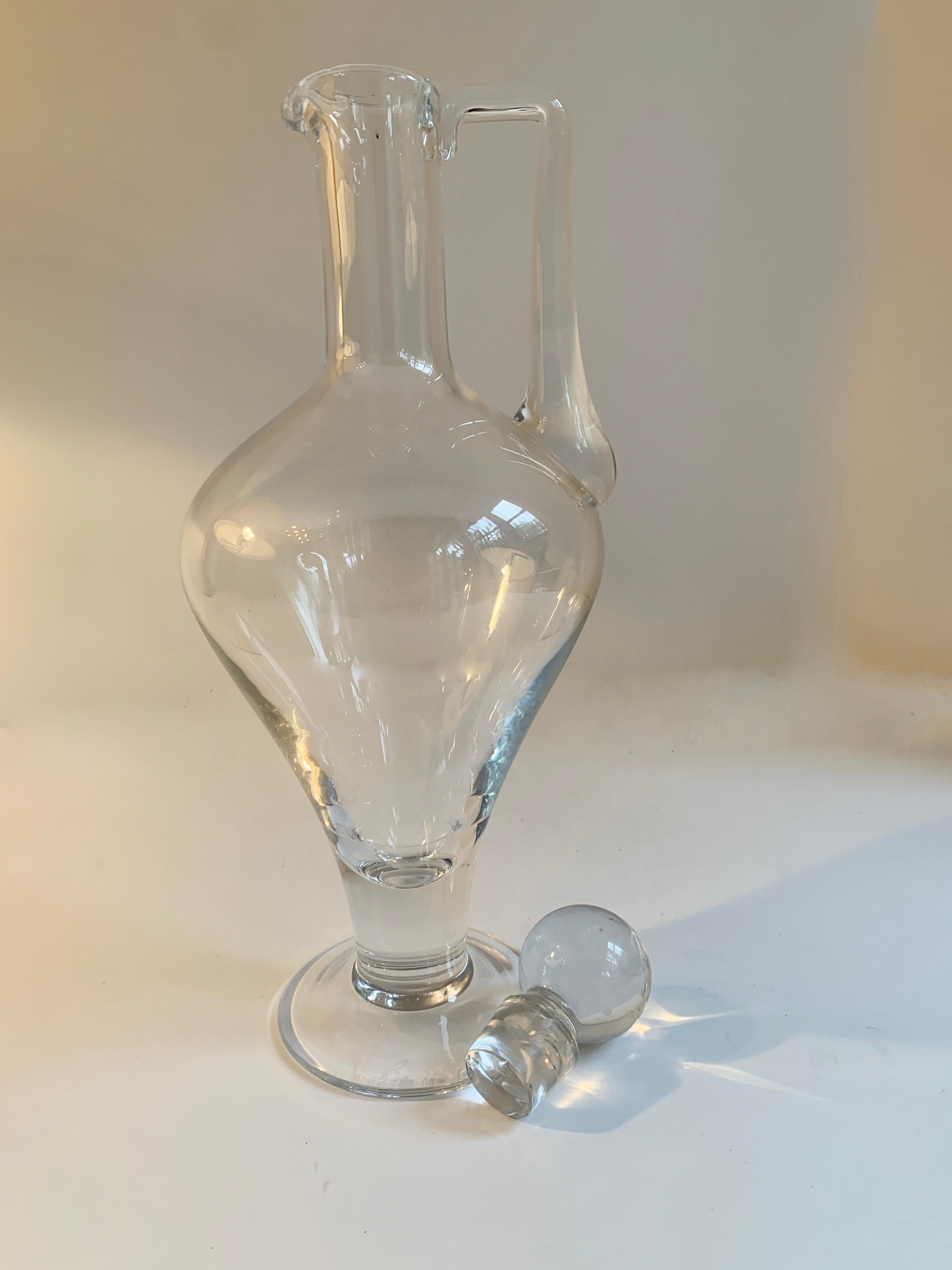 A beautifully designed and shaped decanter with stopper by the Boch Company, designed and signed by Eugen Von Boch. Perfect for the bar or to store water or other liquids for the table.
