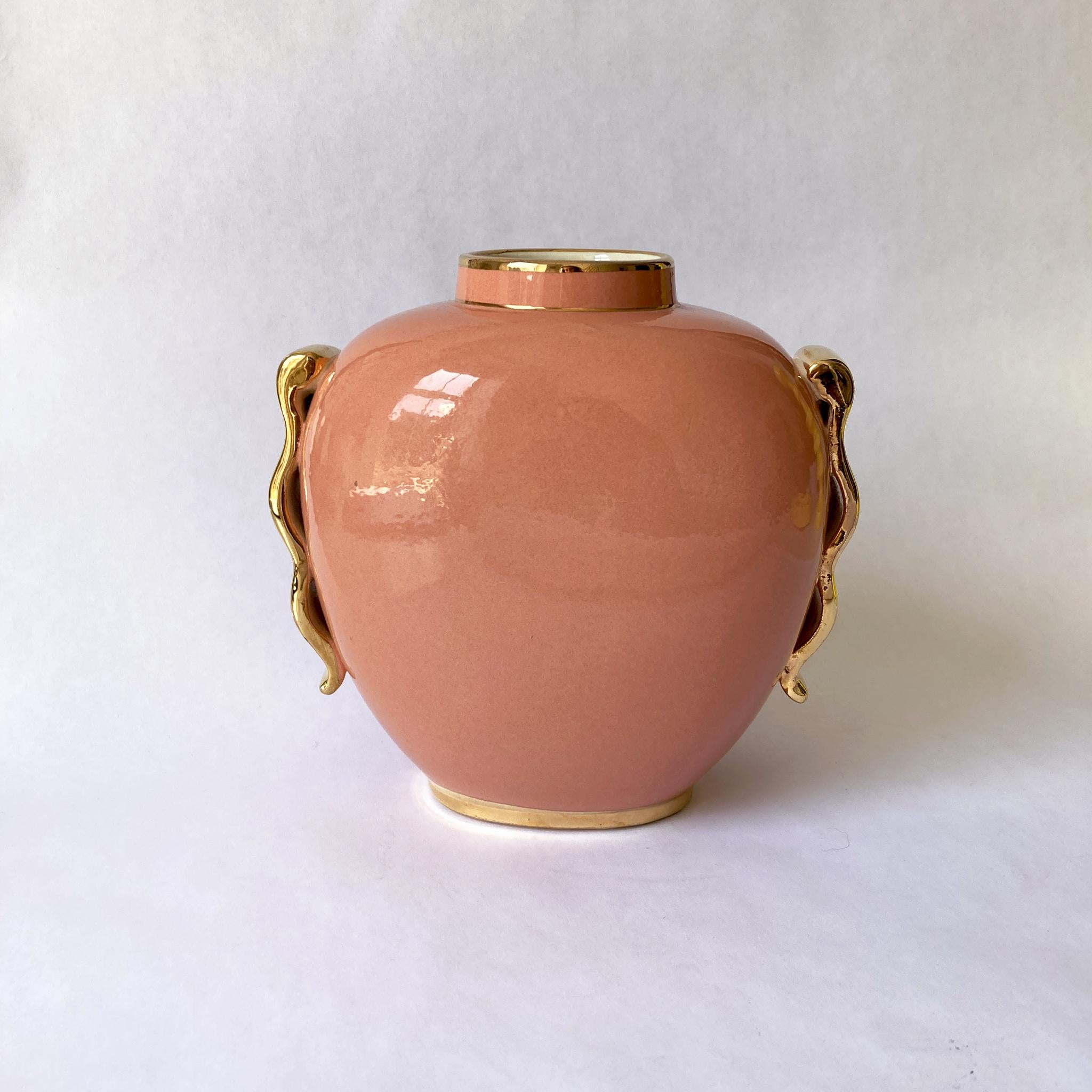 Oval Vase by Boch Frères La Louvière Belgium. Form 1291/0 designed by Raymond Chevallier around 1940. Monochrome Peach body with gold accents on handles and at rim and base. A charming art deco vase. See condition details.

Measures: 
H 6.5