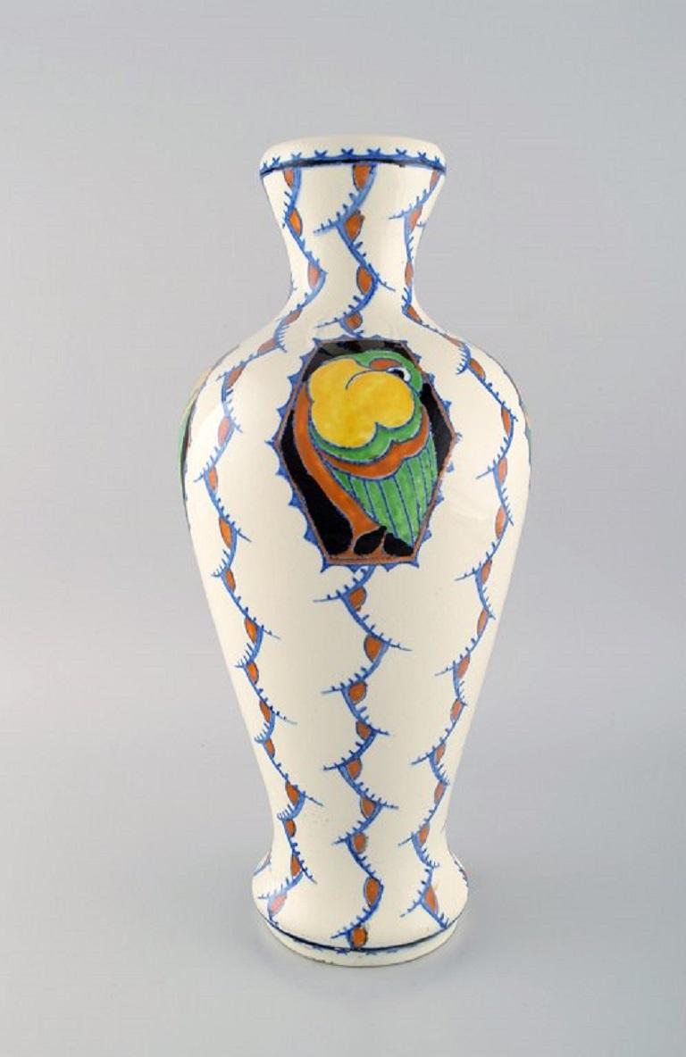 Boch Freres Keramis, Belgium. Large Art Deco vase in glazed ceramics with hand-painted birds. 
1920s / 30s.
Measures: 41 x 19 cm.
In excellent condition.
Stamped.