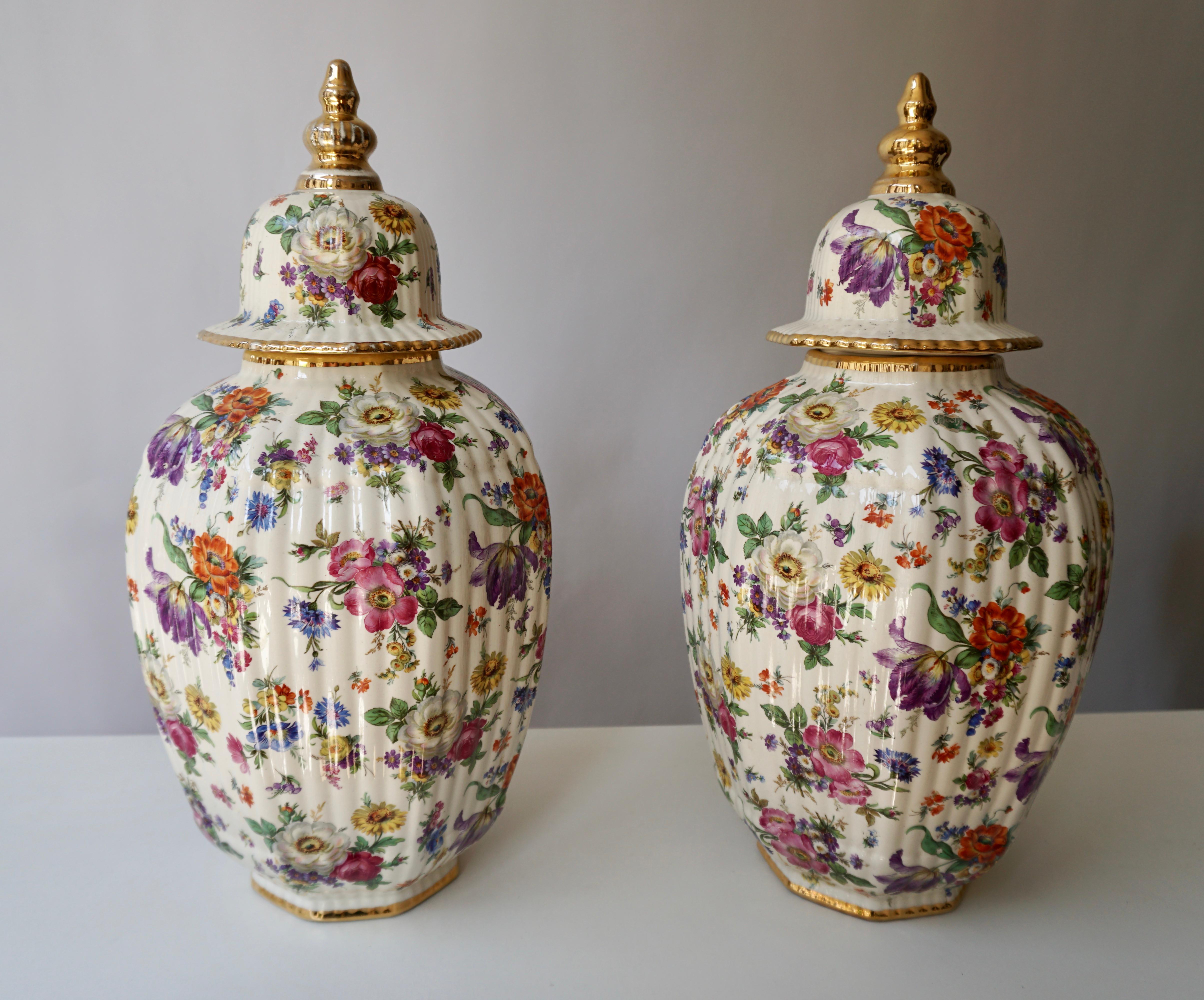 An Art Deco ovoidal vase with floral motif in warm shades covering the body from the Belgian Boch Frères Ceramic Factory. 
The Boch Frères Keramis factory was one of Belgium’s largest producers of ceramics during the early 20th century, developing