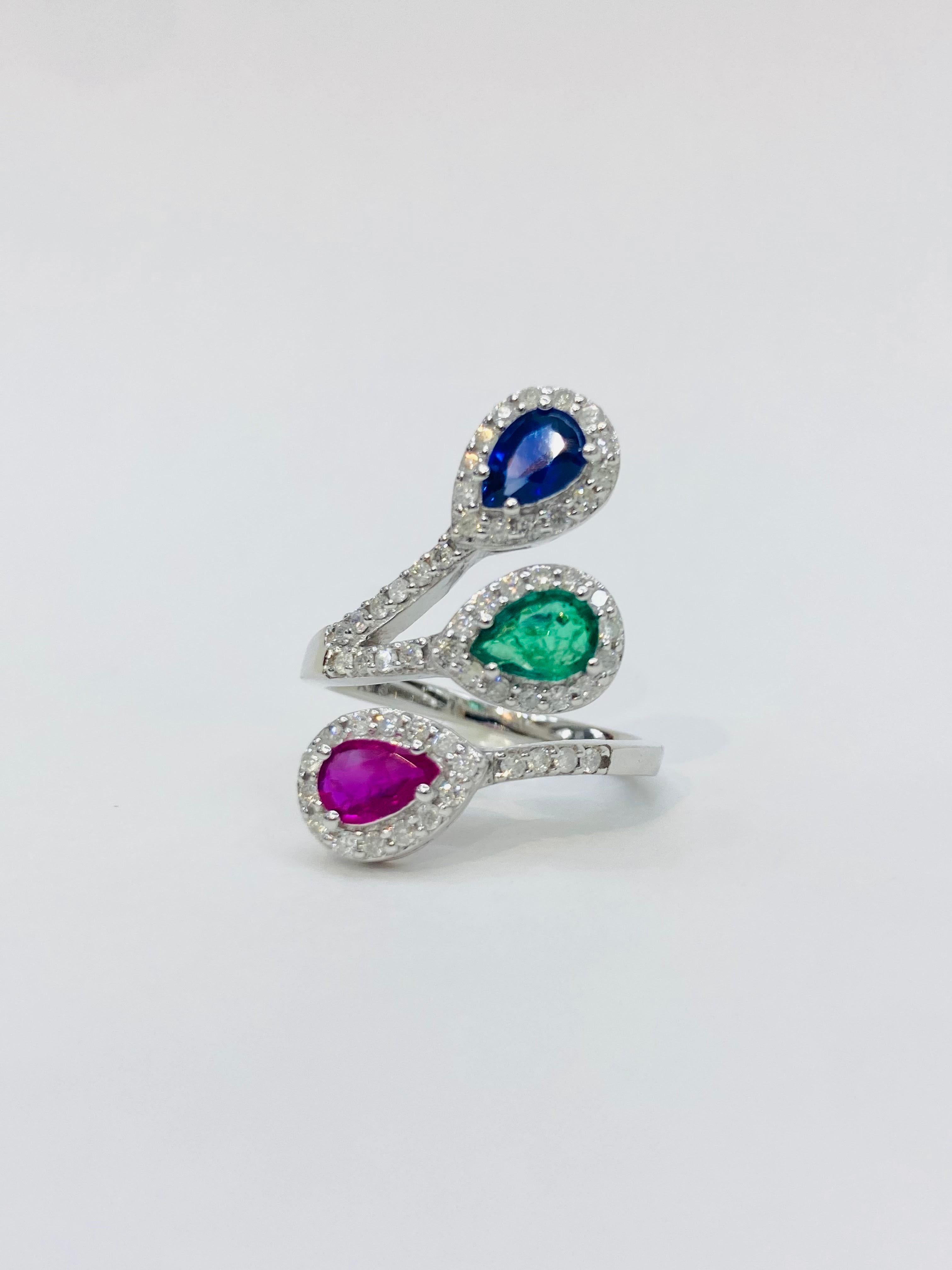 Bochic 3 Color Vintage Ruby, Emerald, Sapphires 18K Gold & Diamond Cluster Ring.

Natural Red Ruby Pear Shape 0.40 Carat 
Natural Blue Sapphire Shape  0.40 Carat 
Natural Green Emerald Shape 0.40 Carat 
Diamonds 0.45 Carat 
F color 
VS clarity 
18K