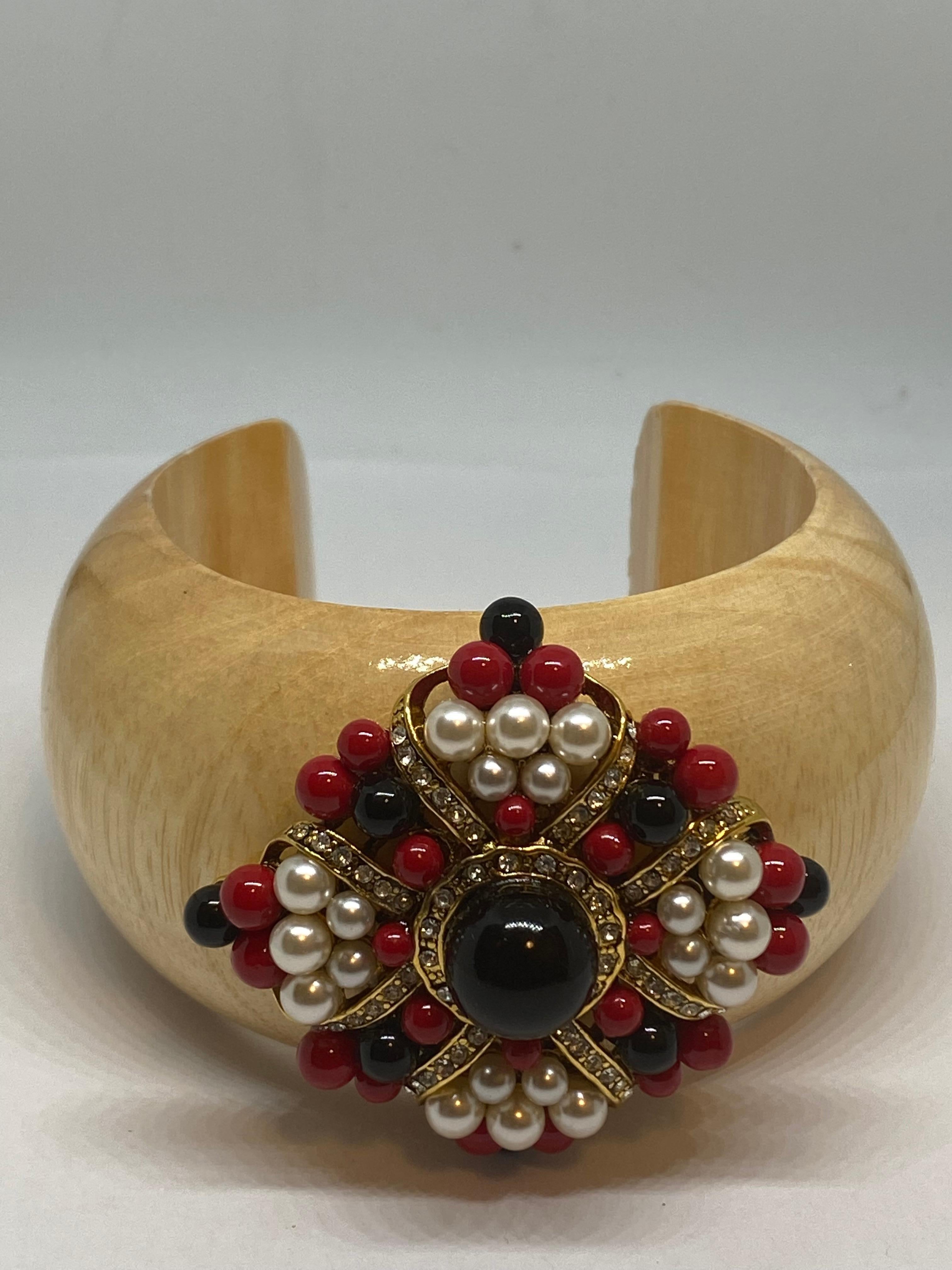 The Ravello Rose”
from the “IKON” private collection. 
Inspired by the Italian color motifs in the Amalfi Coast. 
This Mediterranean resin Flower Cuff uses the red coral color that is a tradition that dates back to the days of ancient Rome, with