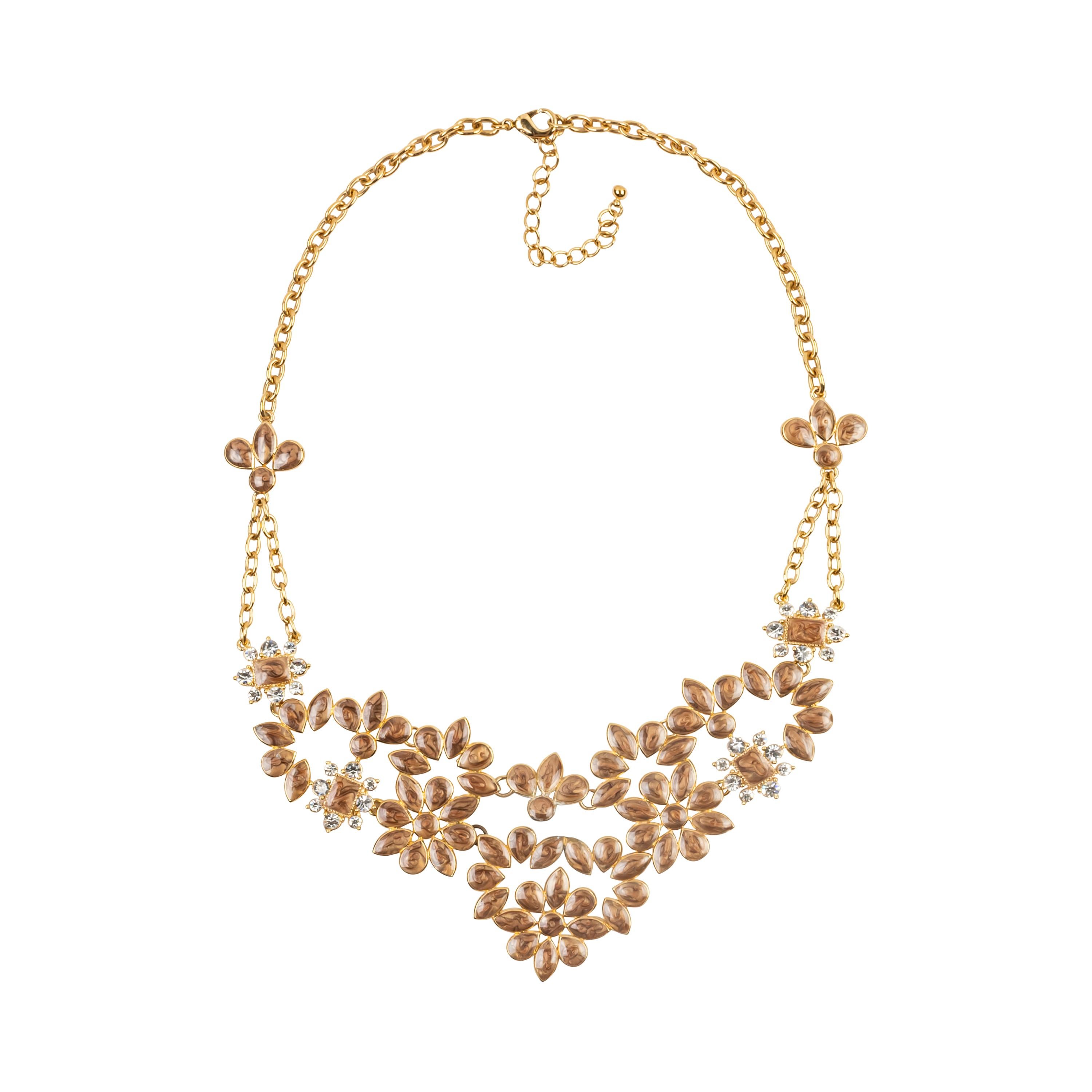 Bochic bijoux necklace.
This beautiful necklace feels and looks like fine jewlery worn on the red carpet or for that special night out or party. 
It has attention to details reserved usually for fine jewlery. 
Gold links with cognac color enamel