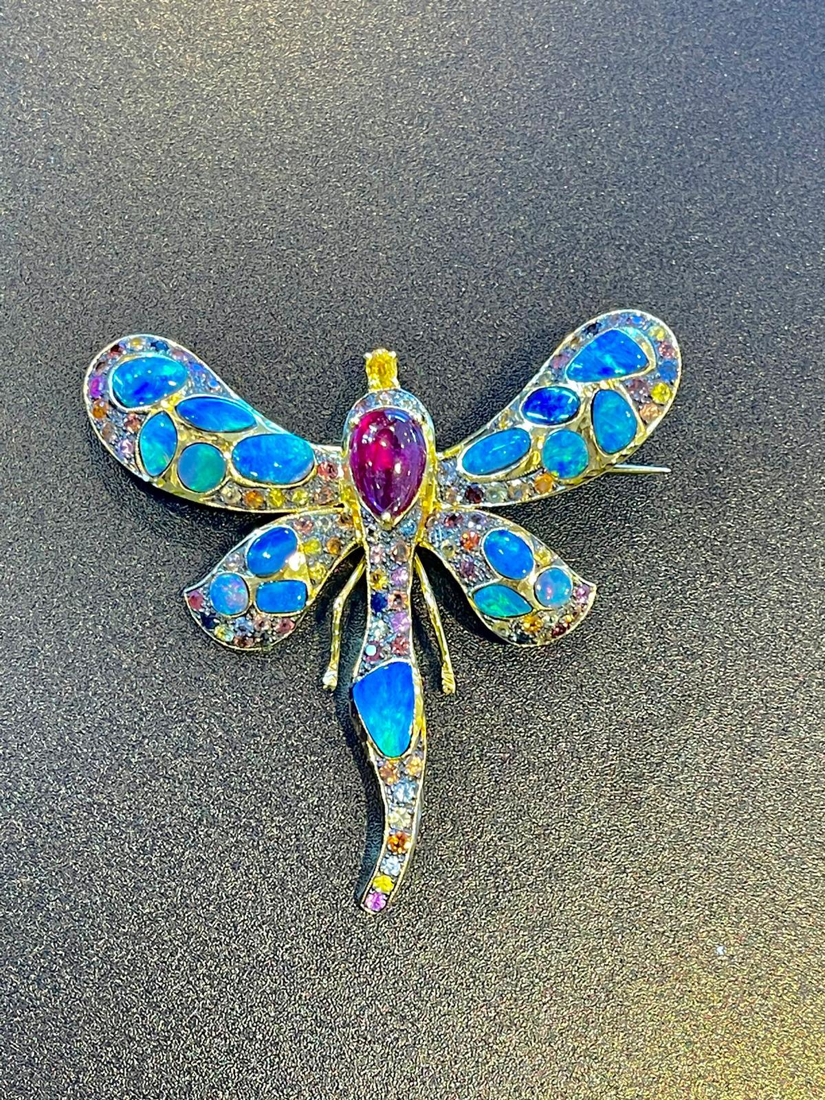 Bochic “Candy Butterfly” Blue Fire Opal, Ruby & Sapphire Brooch 
From the “Capri” collection 
Natural Opals - 11 carats 
Natural shapes 
Natural Ruby Cabochon - 6 carats 
Pear shape 
Natural Fancy color sapphires, round brilliant  - 4.5 carat 
Sri