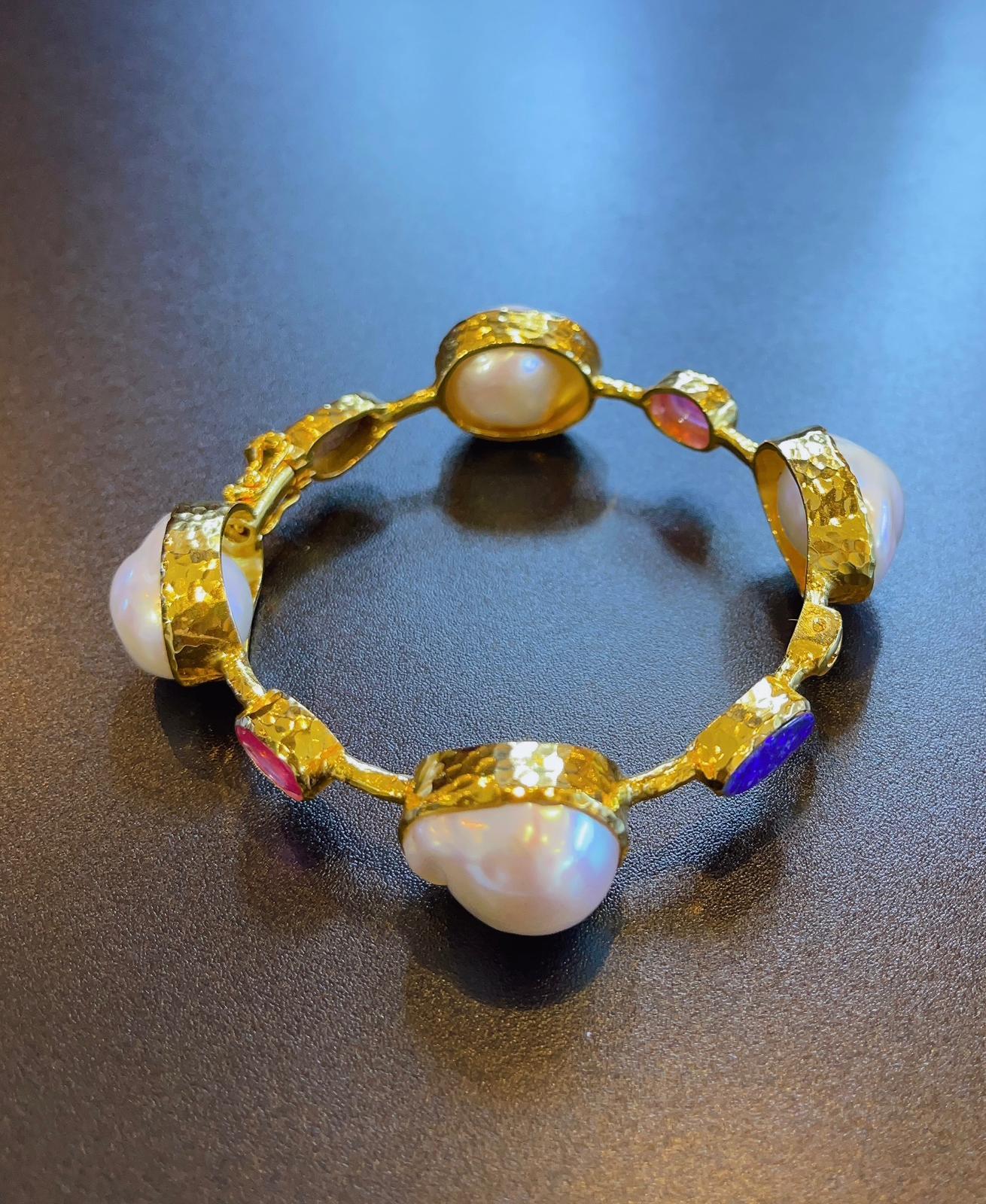 Bochic “Capri” Bangle, Ruby, Australian opal
& South Sea Pearls set in 22 Gold & Silver 
Natural Ruby Cabochon - 4 carats in total, all around the bangle 
Shape - Oval shape 
Natural Australian Opal - 2 carts in total, all around the bangle 
Shape -