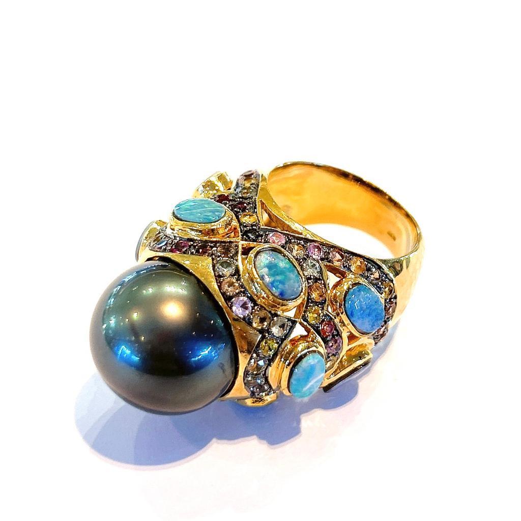 Bochic “Capri” Black Pearl, Opal & Multi Sapphires  Set in 18K Gold & Silver 
Natural Blue opal  - 3 Carats 
Natural Multi color Sapphires, round brilliant shapes - 3 carats 

This Ring is from the 