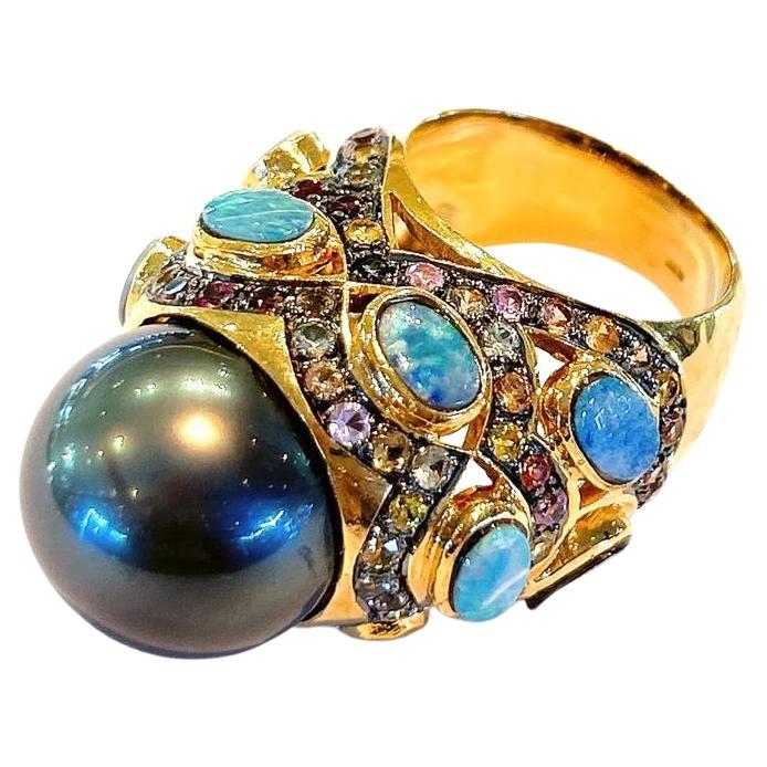Bochic Capri perle noire, opale et plusieurs saphirs  Serti d'or et d'argent 18 carats 