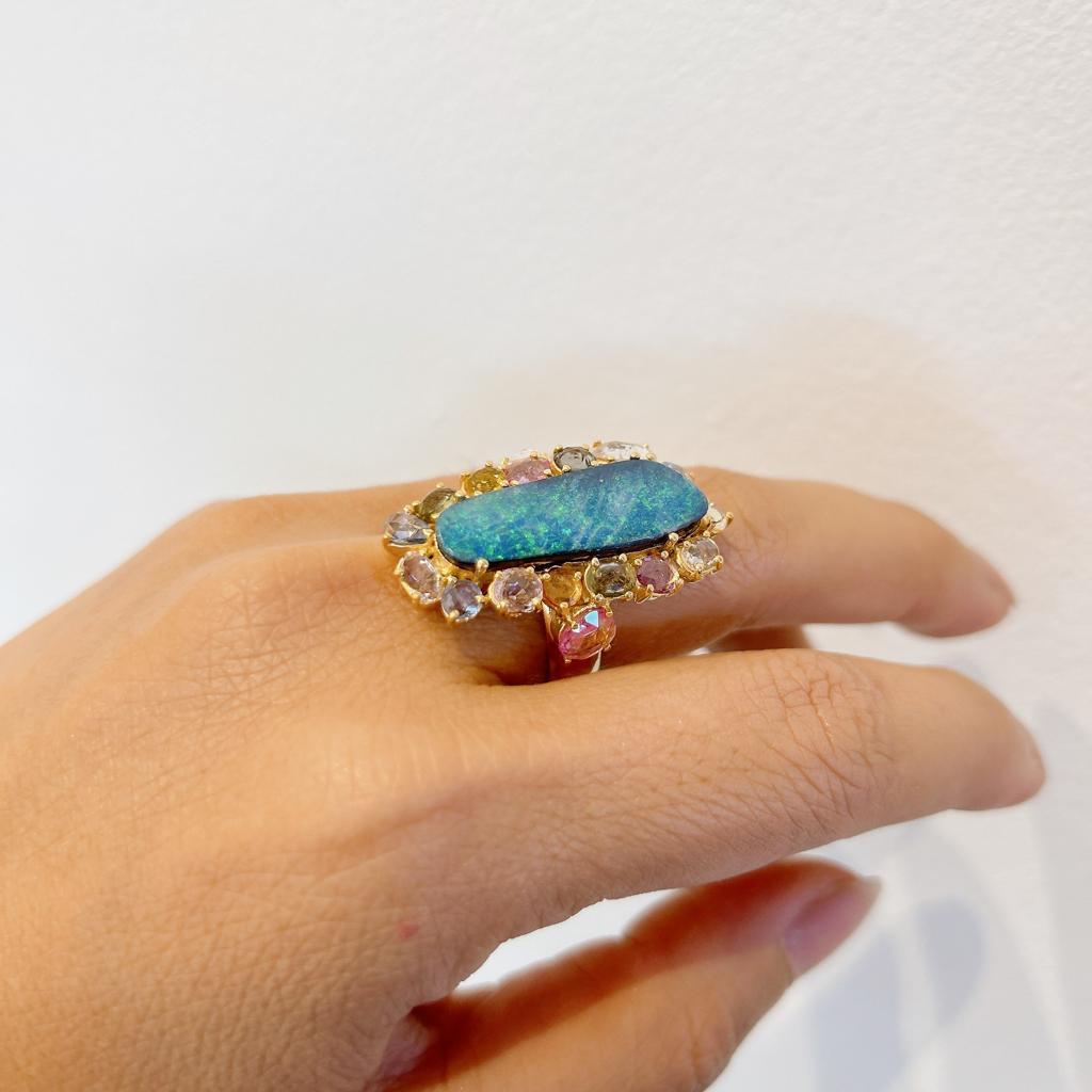Bochic “Capri” Blue Opal & Rose Cut Sapphire Ring Set In 18K Gold & Silver 
Blue Natural Opal - 7 Carats 
From Australia 
Multi color Natural Fancy Color Rose Cut Sapphires from Sri Lanka - 6 Carats 
Sapphire colors; Rose, Pink, Lilac, Light Blue,