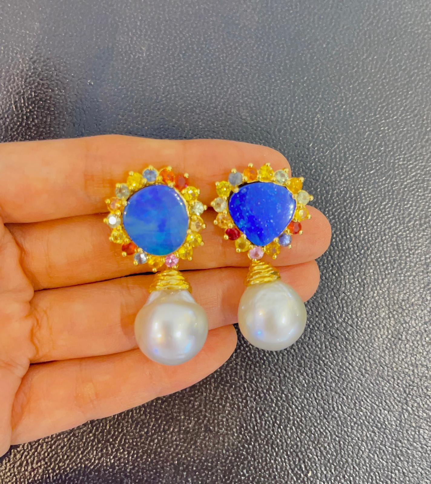 Bochic “Capri” Blue Fire Opal, Sapphire & South Sea Pear Earrings Set In 22K & Silver
From the “Capri” collection 
Natural Opals - 10 carats 
Natural shapes 
Natural Fancy color sapphires, round brilliant  - 4.5 carat 
Sri Lankan 
Sapphire colors -