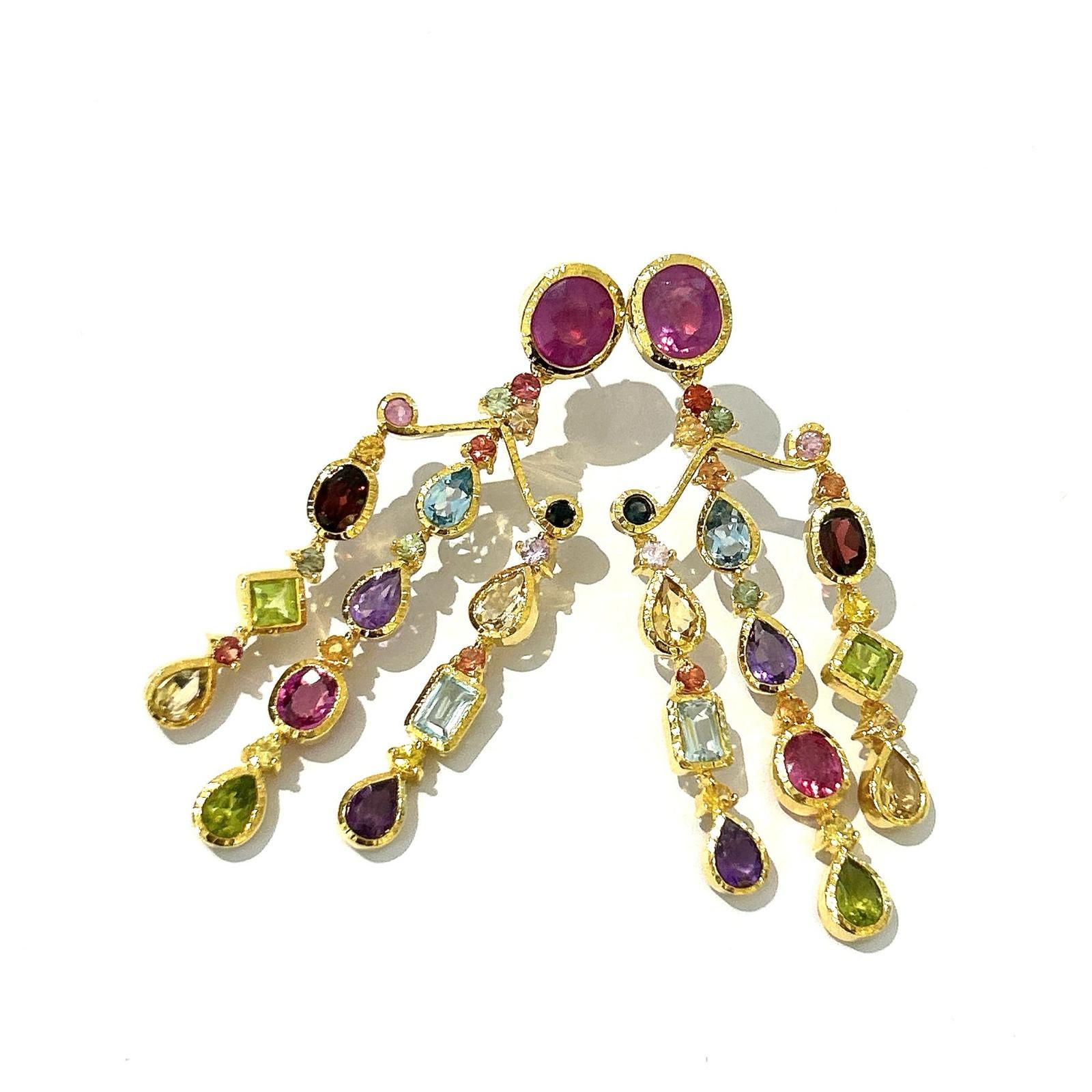 Bochic “Capri” Chandelier Ruby & Multi Gem Earrings Set In 18K Gold & Silver 

Natural Red Oval Cut Ruby - 7 Carat 
Mix natural gems - 9 Carat 
(Topaz, Amethyst, Sapphire)
Natural Sapphire - 2 Carat 


The earrings from the 