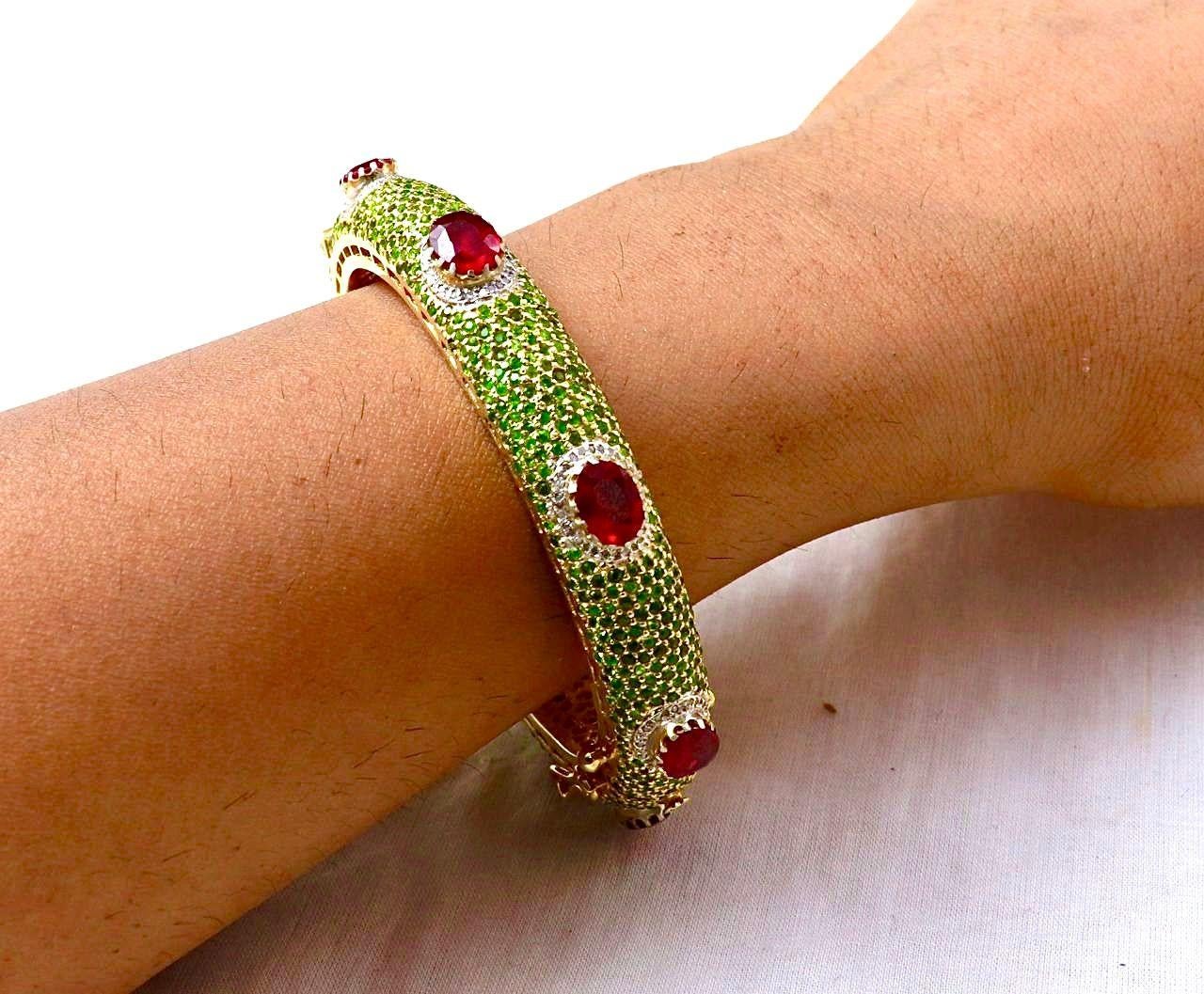 Bochic “Capri” Emerald, Ruby & Diamond Bangle Set In 18K Gold & Silver

Natural Emeralds - 4 Carat
Natural Rubies - 14 Carat 
Natural Diamonds - 3 Carat 

This Bangle is from the 