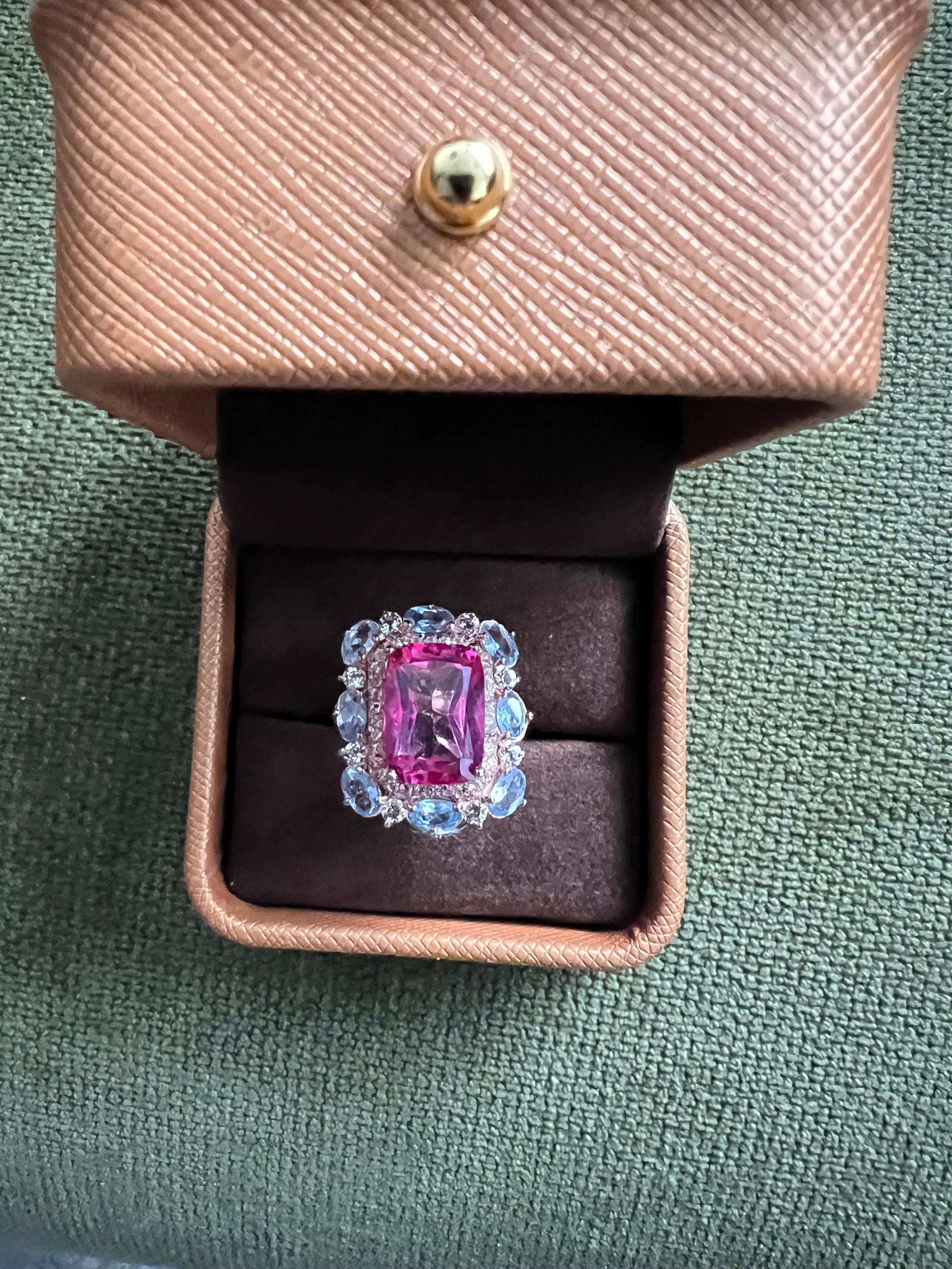 Classic Italian Bochic “Capri” Pink Topaz & Tanzanite Ring Set In 18K Gold & Silver 

Natural Red Pink Topaz , Radiant Cut Shape 
7.00 carats 
Natural Multi Tanzanite & White Topaz
3.00 carats 

This Ring is from the 