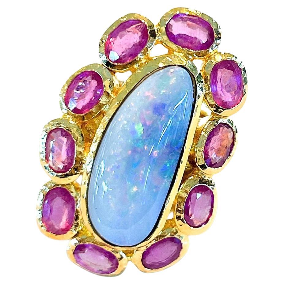 Bochic “Capri” Cocktail Ring 
Natural Beautiful Fire Opal Cabochon - 19 carats
Natural Oval brilliant shape Ruby’s - 12 carats 
Set in 22K Gold and Silver 950
This Ring is perfect to wear - Day to night, swim wear to evening wear.
Vintage style