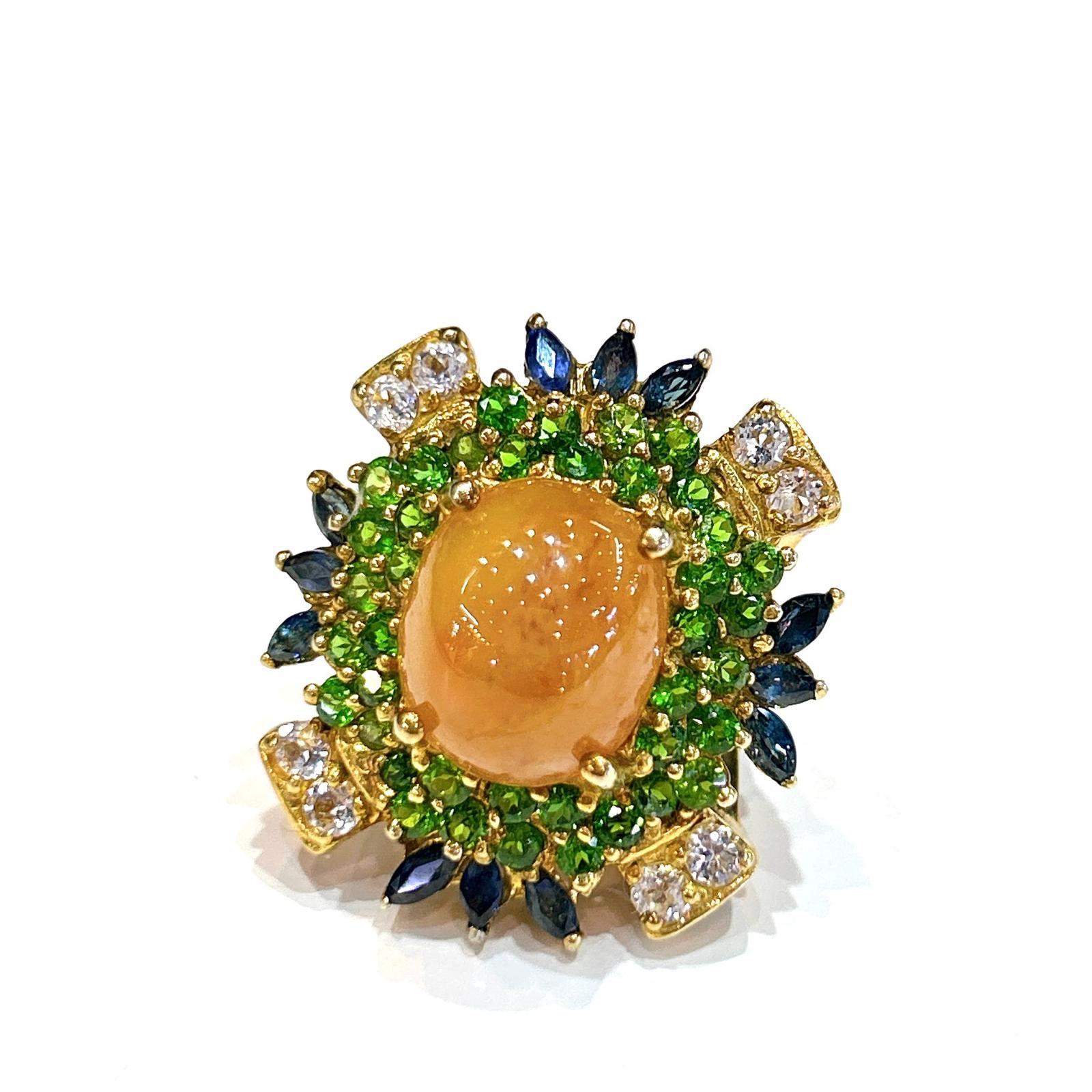 Bochic “Capri” Honey Sapphire, Garnet & Sapphire Ring Set In 18K Gold & Silver 

Natural Honey Sapphire - 7.00 carats 
Natural Multi White Topaz 1.00 carats 
Natural Green Garant  - 2,00 carats 
Natural Blue Sapphire - 1.00 carats 

This Ring is