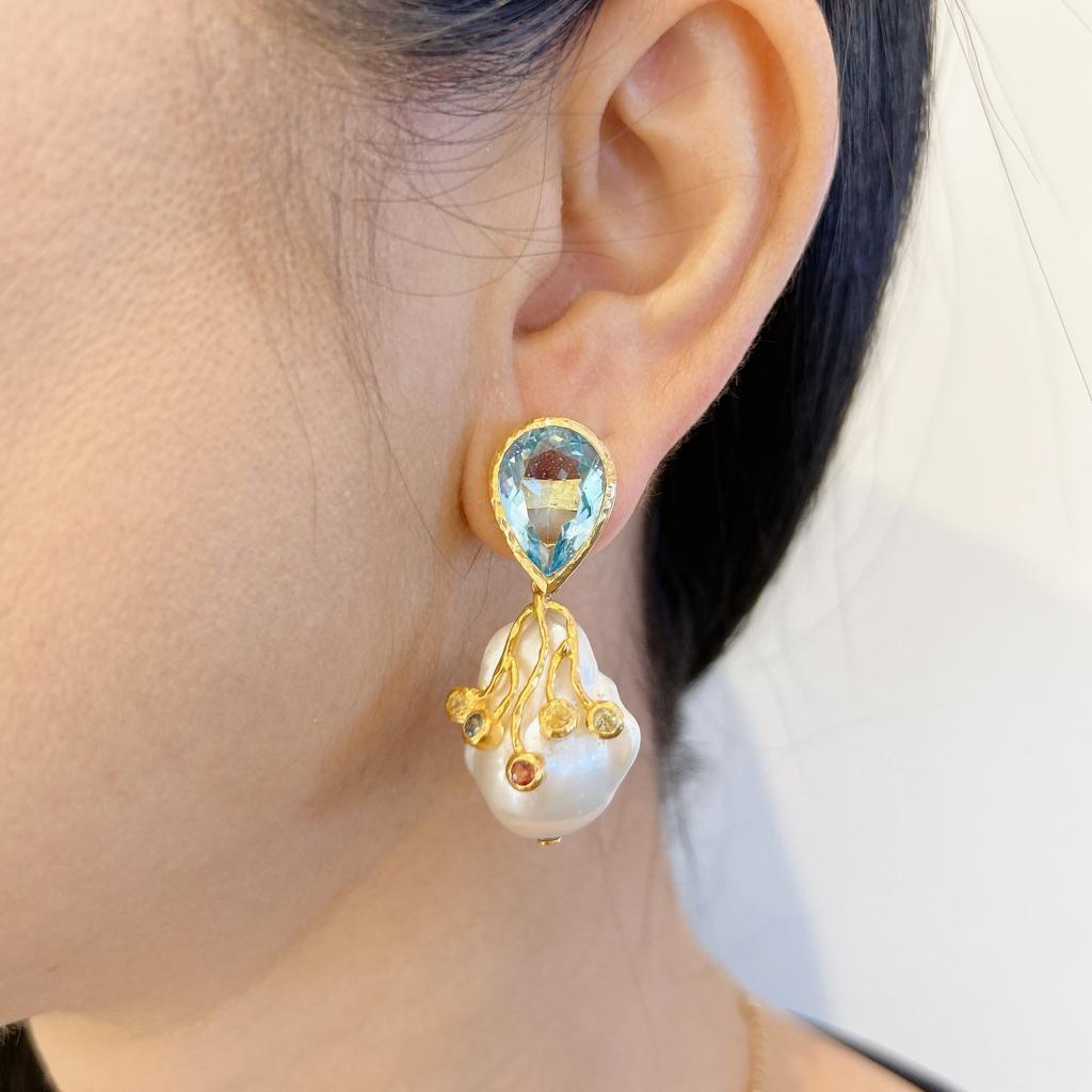 Bochic “Capri” London Topaz & Sapphire Earrings Set In 18K Gold & Silver 
Pear Shape natural London Topaz Gems - 7 Carats 
Multi Color Sapphires from Sri Lanka, round brilliant shapes 
1.5 carats
The earrings from the 