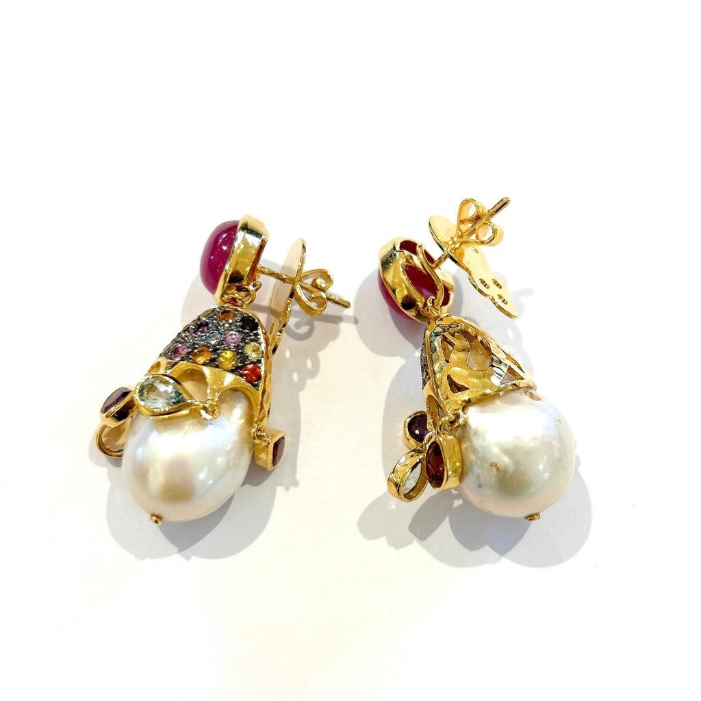 Bochic “Capri” Multi Sapphire, Ruby & Pearl Earrings Set In 18K Gold & Silver 
Natural Multi color Sapphire - 1.30 Carat 
Natural Red Ruby cabochons from Sri Lanka 
8 Carats 
White Natural Topaz 
South sea white pearls with pink tones 

The earrings