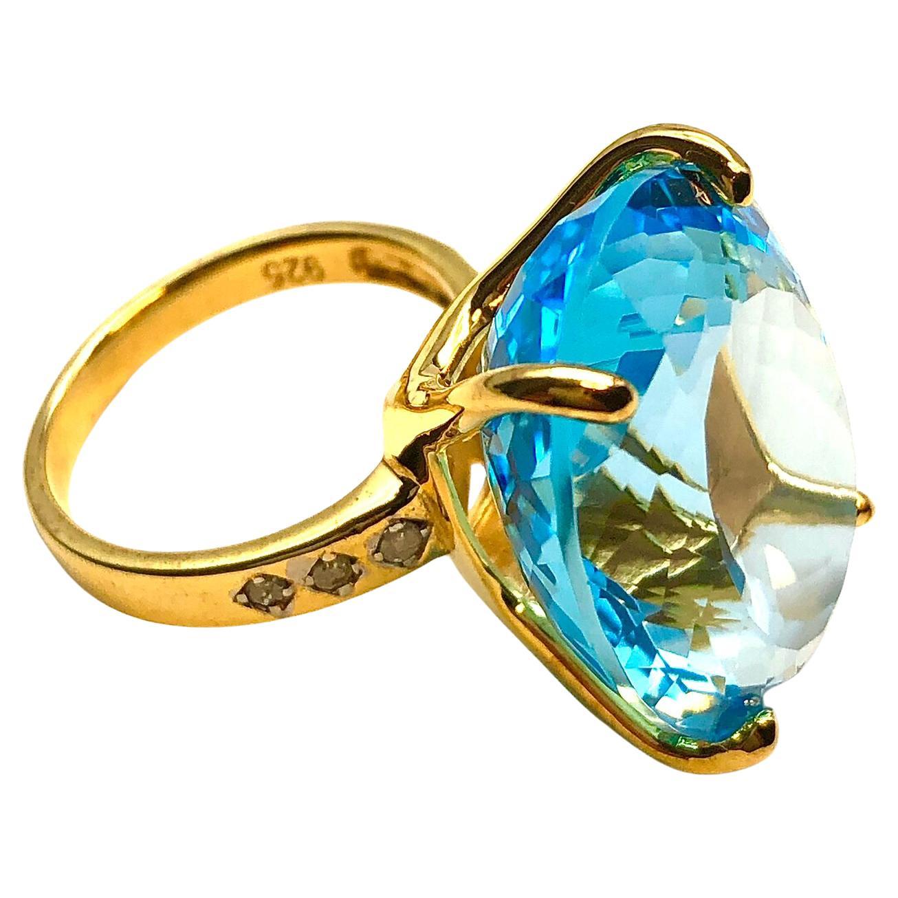 Bochic Capri en or et argent 18 carats serti d'une topaze bleue de forme ovale naturelle