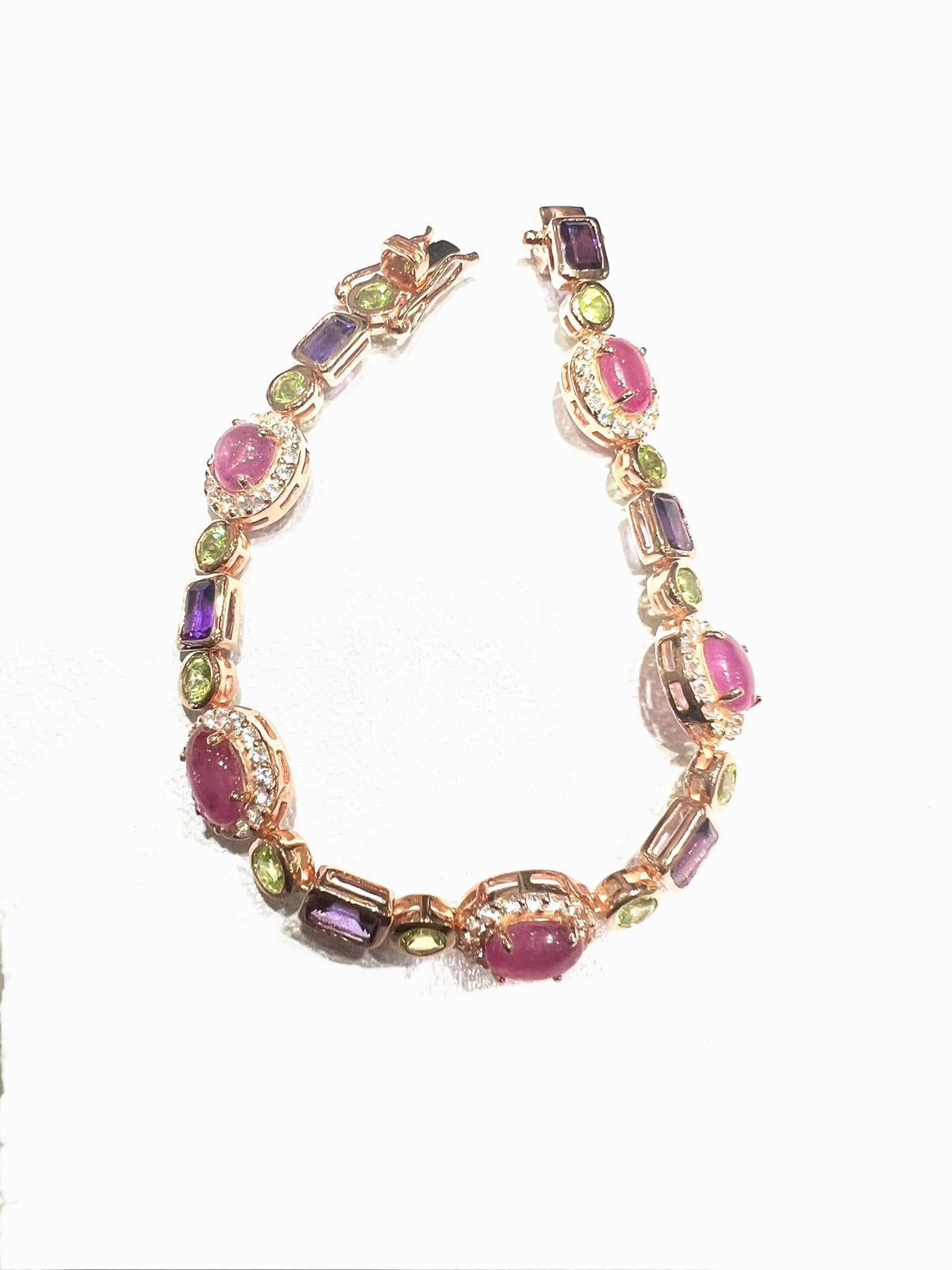 Bochic “Capri” Natural Ruby, Amethyst & Peridot Bracelet Set 18K Gold & Silver

open and close hinge and safety locks 

Natural Rubies - 16 Carats 
Natural Amethyst  - 9 Carats 
Natural Peridot - 6 Carats 
Natural White Topaz - 4 Carats 

The Bochic