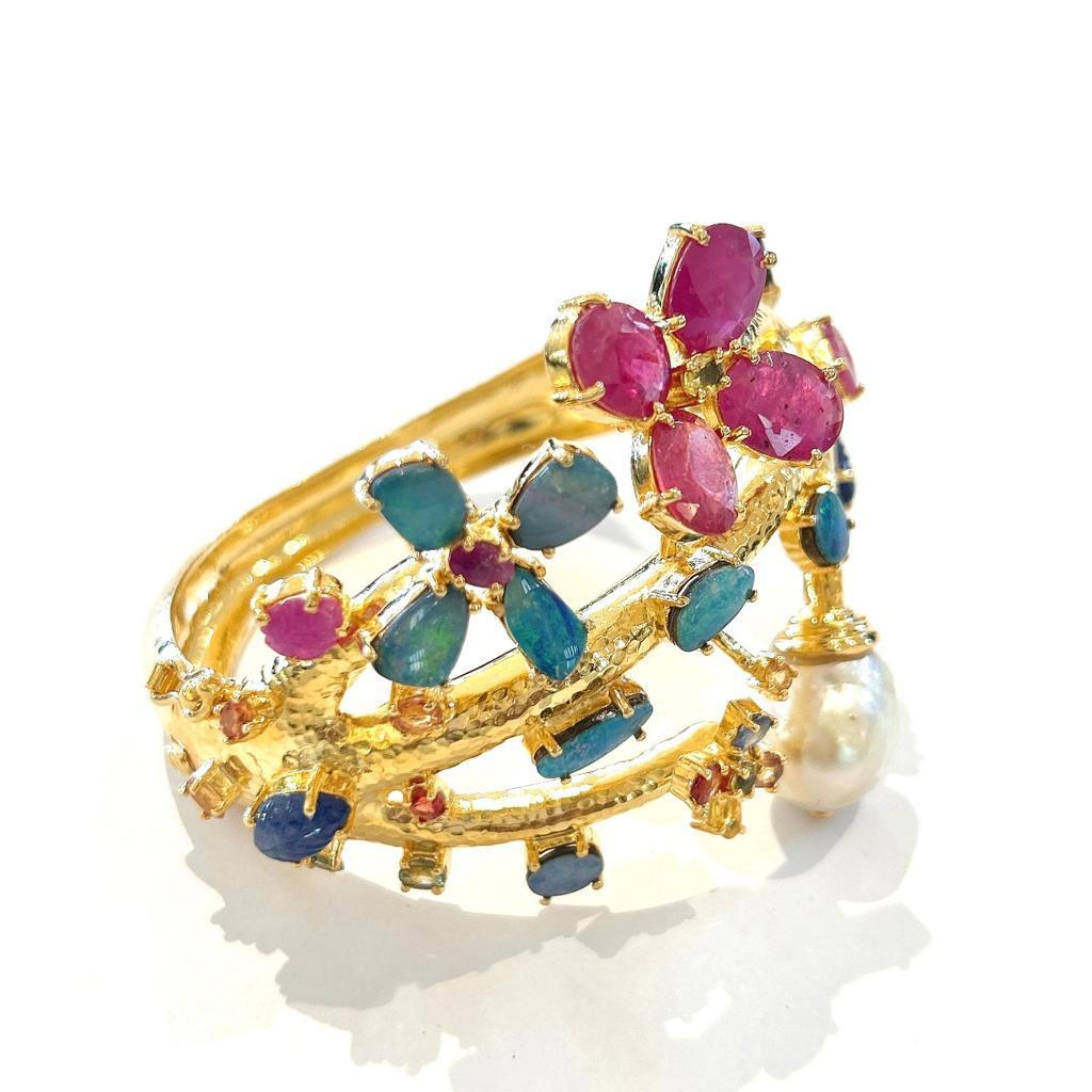Bochic “Capri” Natural Ruby, Sapphire & Blue Opal Bangle Set In 18k Gold&Silver 


Natural Oval Shape Red Rubies - 7 Carats 
Natural Blue Australian Opals - 5 Carats 
South Sea White Baroque Pearl 
Multi color Sapphires 

This Bangle is from the