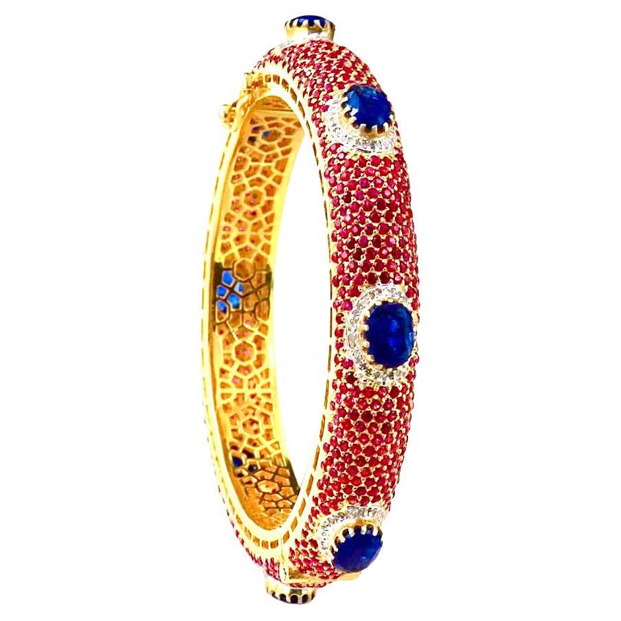 Bochic “Capri” Natural Ruby, Sapphire & Diamond Bangle Set In 18K Gold & Silver

Natural Blue Sapphires - 15 Carat 
Natural Rubies - 4 Carat 
Natural Diamonds - 3 Carat 

This Bangle is from the 