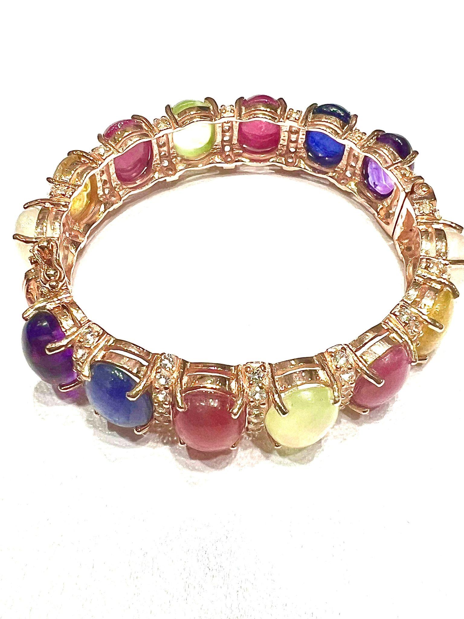 Bochic “Capri” Natural Ruby, Sapphire & Peridot Bracelet Set 18K Gold & Silver

open and close hinge and safety locks 

Natural Rubies 
Natural Blue Sapphire 
Natural Yellow Sapphire 
Natural Amethyst 
Natural Peridot 
34 Carats 

The Bochic 