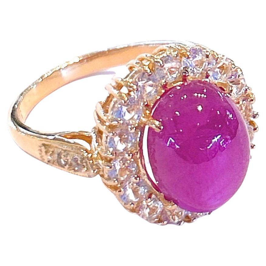 Bochic “Capri” Natural Red Ruby & White Topaz Ring Set in 18K Gold & Silver 
Natural Ruby Cabochon - 12 Carats 
White Natural White Topaz, round brilliant shapes - 3 carats 

This Ring is from the 