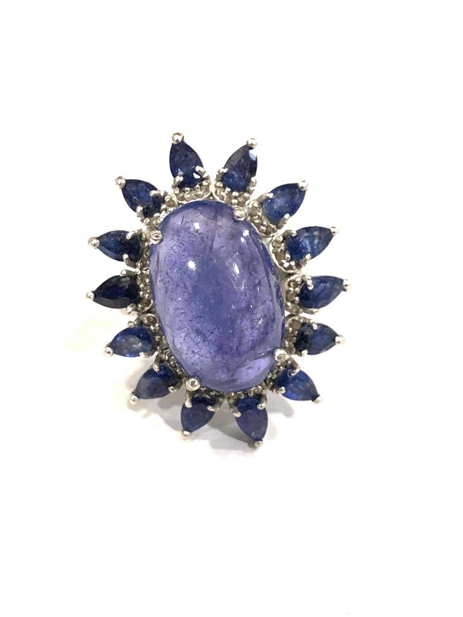 Bochic �“Capri” Natural Tanzanite & Natural Diamonds Vintage Retro Ring Set In 18K White Gold & Silver 

Natural Oval Shape Center Tanzanite 
10,00 Carat 
Natural Diamonds 
1.00 Carat
Natural Pear Shapes Tanzanites 
4.00 carat 

This Ring is from the
