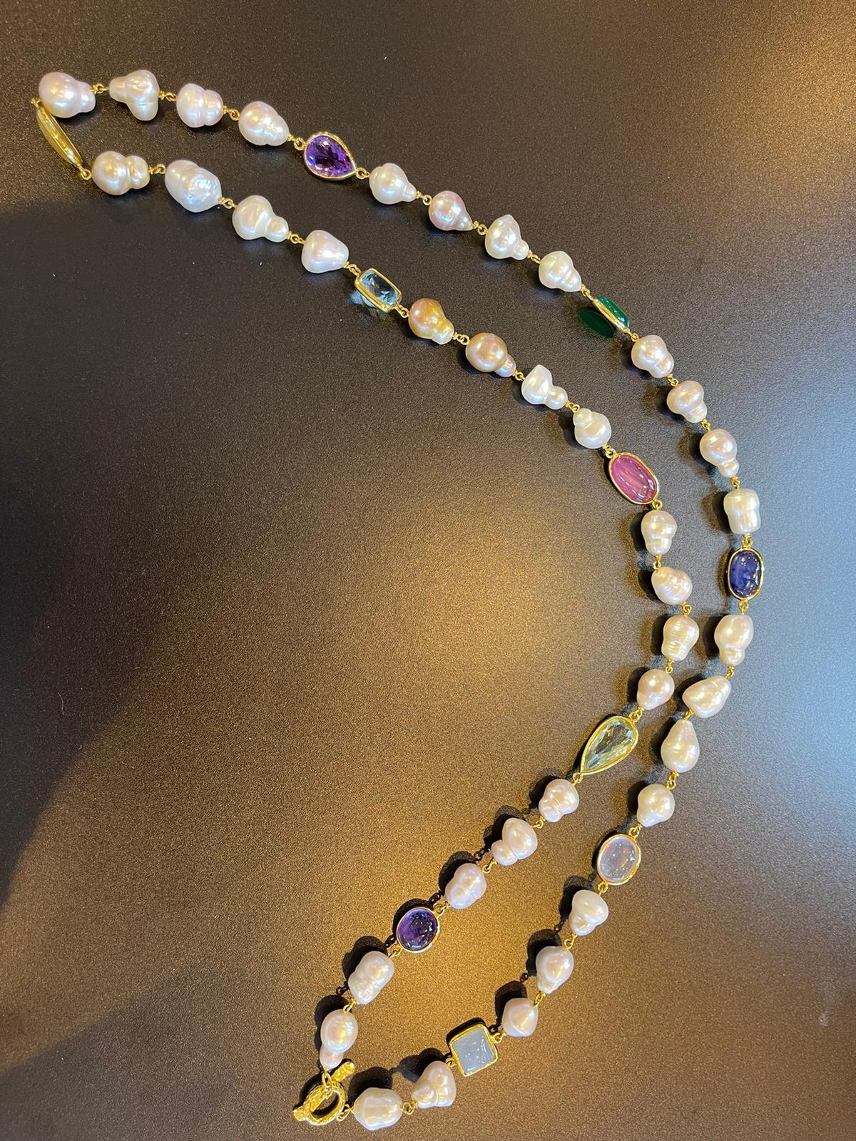 Bochic “Capri” Necklace
& South Sea Pearls set in 22 Gold & Silver 
Natural Red Ruby Cabochon - 12 carats in total
Shape - oval shape 
Baroque white south sea natural cultured pearls 
White color, with pink and silver tones 
Mix Natural gems 106
