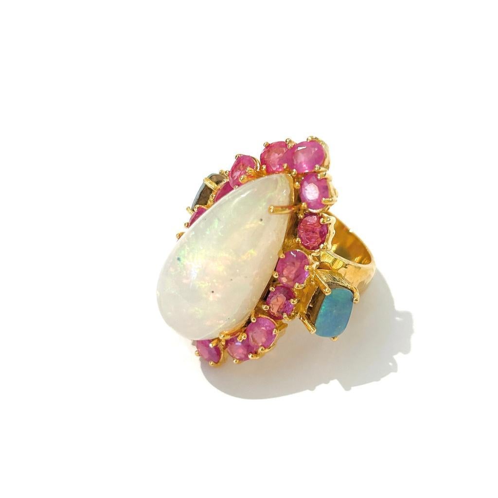 Bochic “Capri” Opal & Ruby Cocktail Ring Set In 18 K Gold & Silver 

White Natural Opal, Pear Shape - 22 Carat
Red Natural Rubies, Oval Shapes - 10 Carat 
Blue Natural Opals - 2 Carat

This Ring is from the 