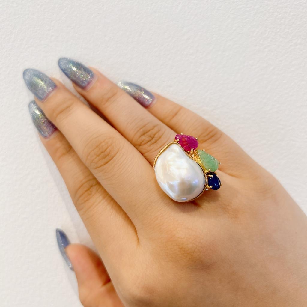 Bochic “Capri” Pearl, Ruby, Sapphire & Emerald Ring Set In 18K Gold & Silver 
Carved Natural Red Ruby - 0.50 carat
Carved Natural Green Emerald - 0.50 carat 
Carved Natural Blue Sapphire - 0.50 carat
Baroque white pearl with pink tone 
This Ring is