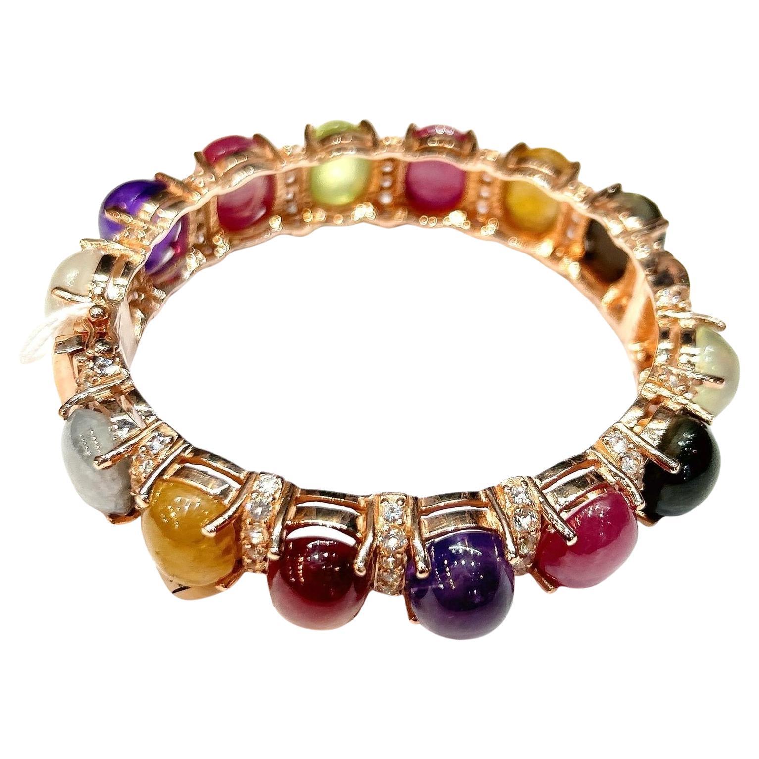 Bochic “Capri�” Purple Amethyst & Multi Color Sapphires Cuff Set In 18K & Silver 

Purple Amethyst  - 3 Carats 
Blue Sapphire - 5 Carats 
Yellow Sapphire- 5 Carats 
Red Ruby - 5 Carats 
Light Blue Aquamarine - 3 Carats 
White Topaz - 2 Carats 

The