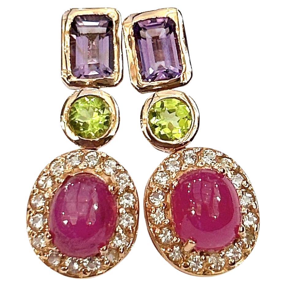 Bochic “Capri” Ruby, Amethyst, & Peridot Earrings Set in 18K Gold & Silver 

Ruby - 5  Carats 
Green Peridot  - 2  Carats 
White Topaz - 1 Carats 
Purple Amethyst -3 Carats 

The Bochic 