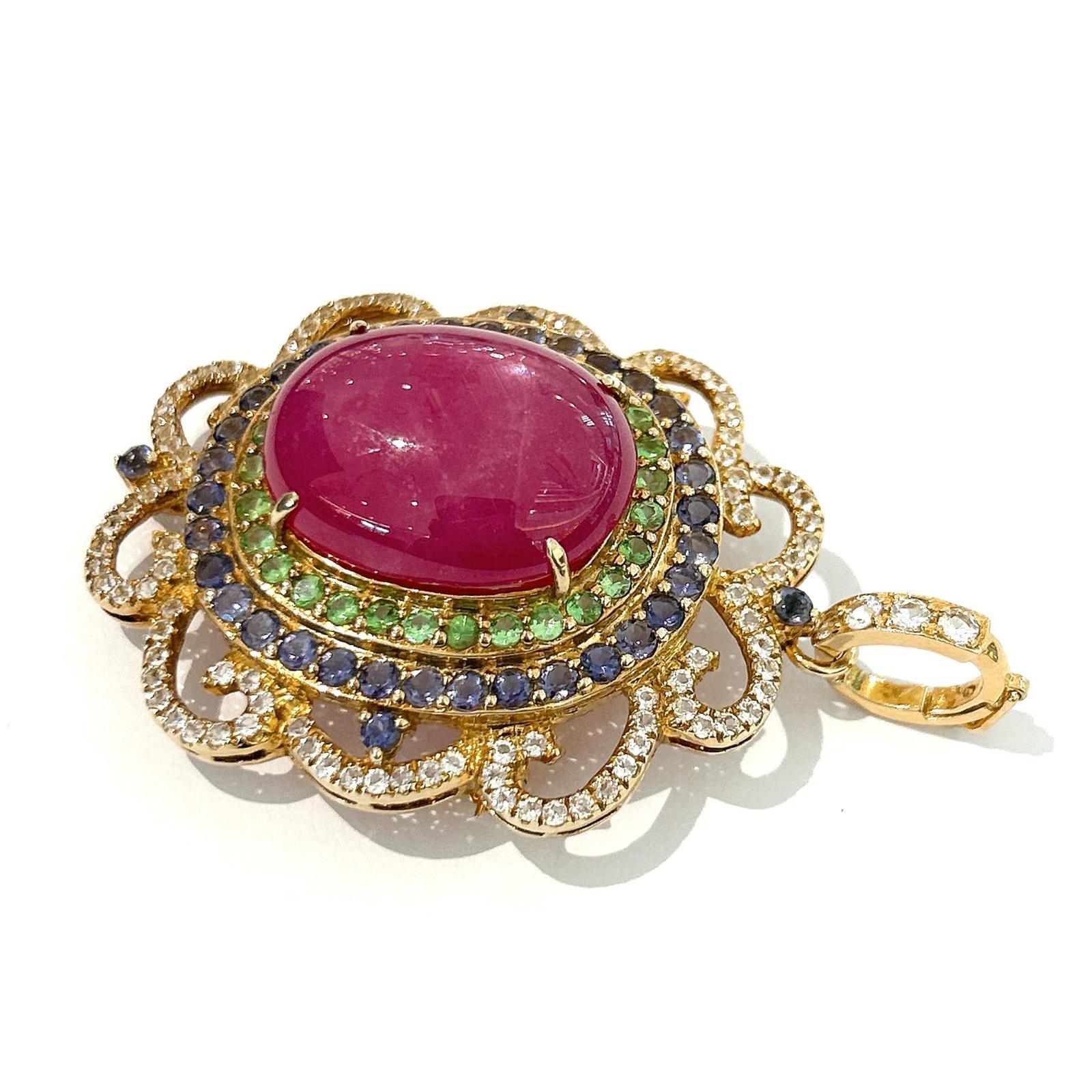 Bochic “Capri” Ruby, Blue Sapphire & Multi Gem Brooch Set In 18K Gold & Silver 

Natural Ruby, Oval shape - 12 carat 
Natural White Topaz from Sri Lanka 
2  carat
Natural Garant - 1 carat  
Natural Blue sapphire - 1.50 carat 

The Brooch is from the