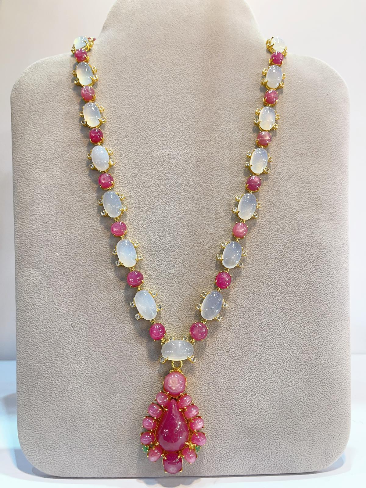 Fantastic Bochic “Capri” Multi Natural Gem Necklace
Natural Ruby, Colors - Red, Pink, 35 Carats 
Shape cabochons 
Large Ruby drop - Pear shape 
Natural White Carsidoni - 34 Carats 
Shape - Oval shapes 
Set in 22K Gold and Silver 
This Necklace is a
